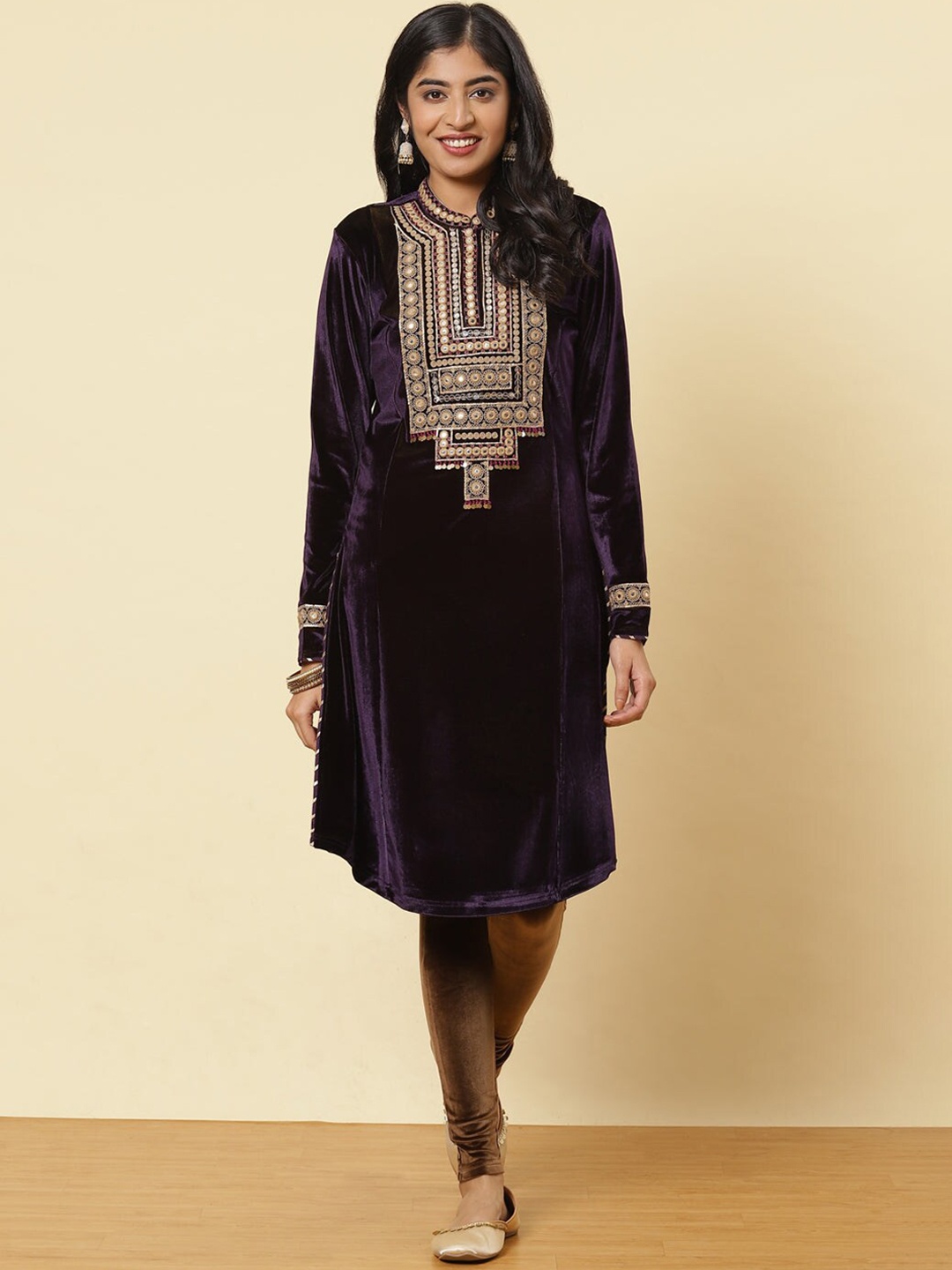 

Lakshita Women Purple Embellished Keyhole Neck Flared Sleeves Thread Work Velvet Kurti