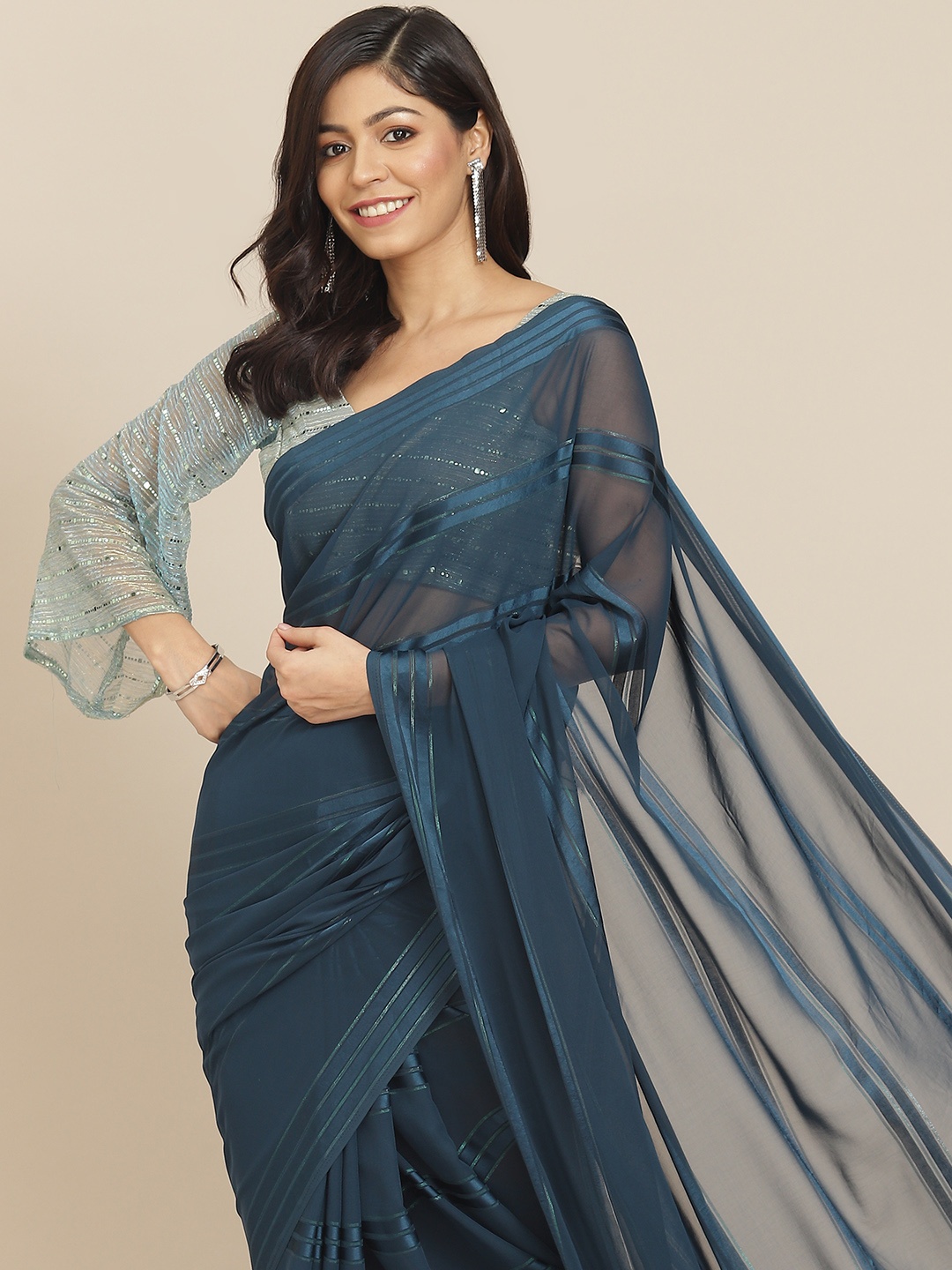 

Tikhi Imli Teal Green Striped Saree