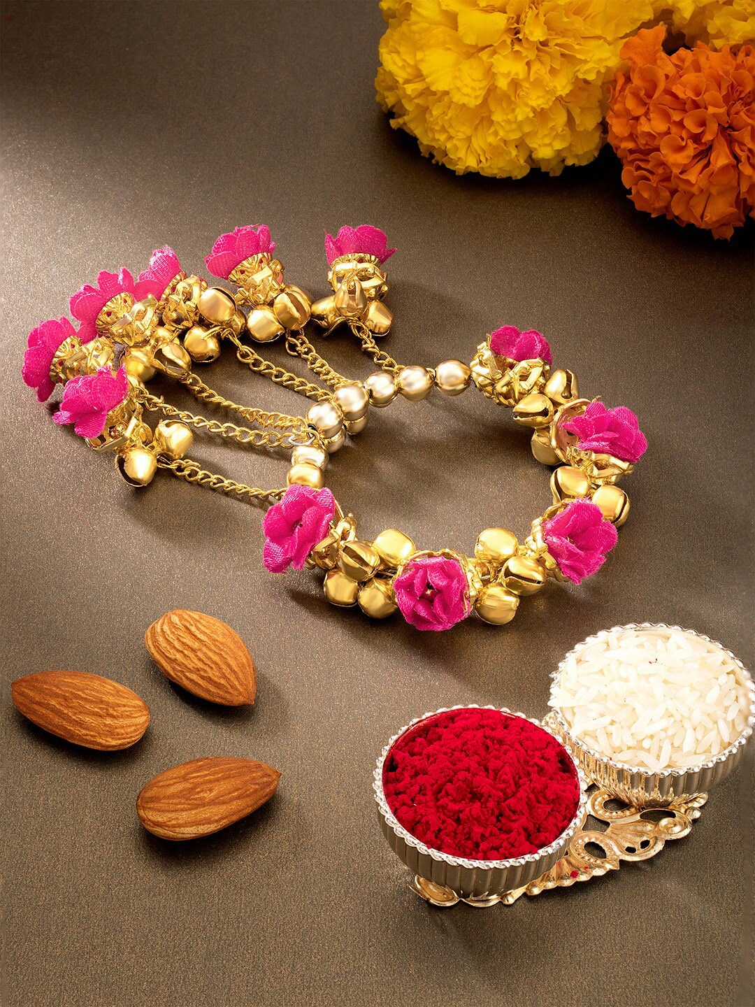 

Peora Women Gold-Toned & Magenta Bangle Style Ghungru Dangling Rakhi