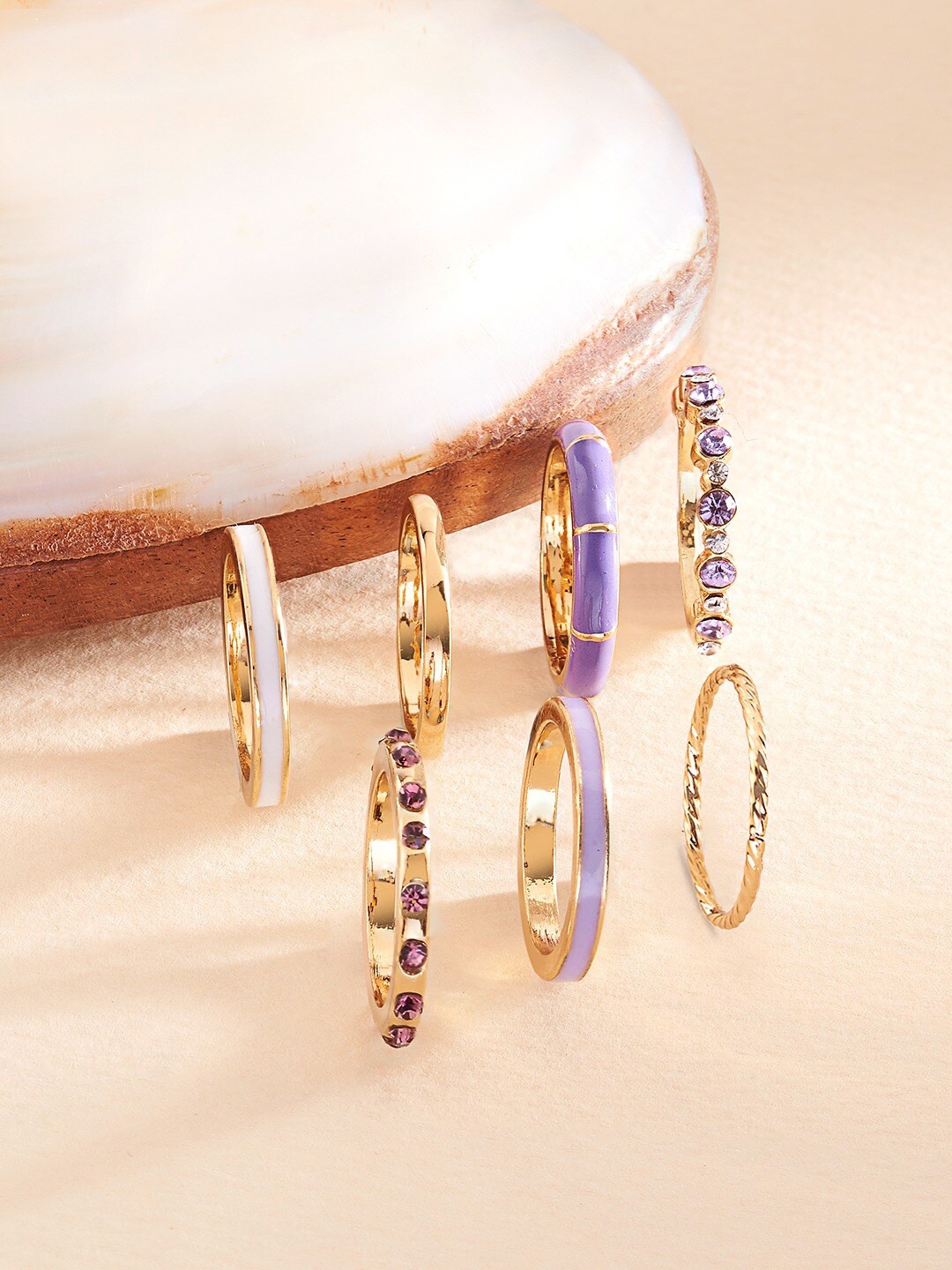 

AMI Set Of 7 Gold Plated Purple-Coloured Stone Studded Ring