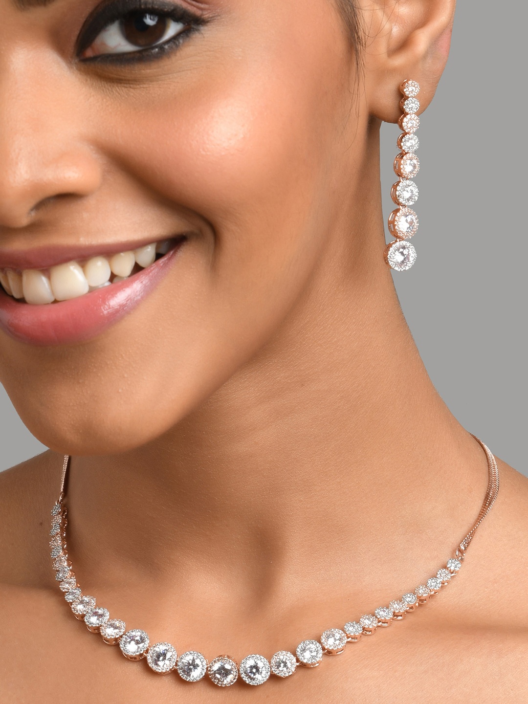 

Fida Rose Gold-Plated White AD Studded Jewellery Set