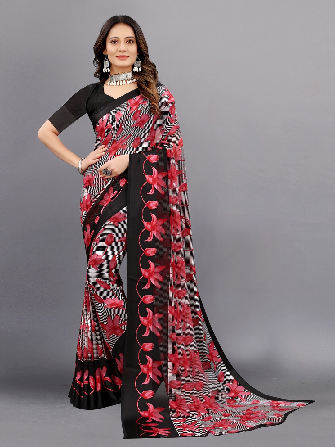

APNISHA Pink & Black Floral Zari Pure Georgette Saree