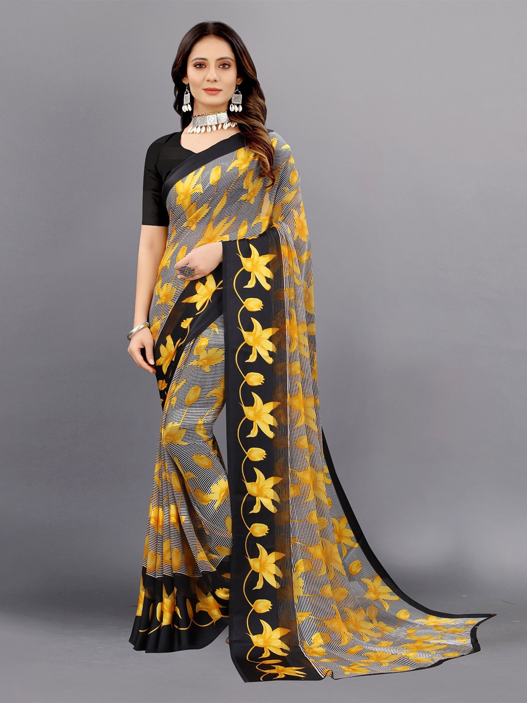 

APNISHA Yellow & Black Floral Zari Pure Georgette Saree