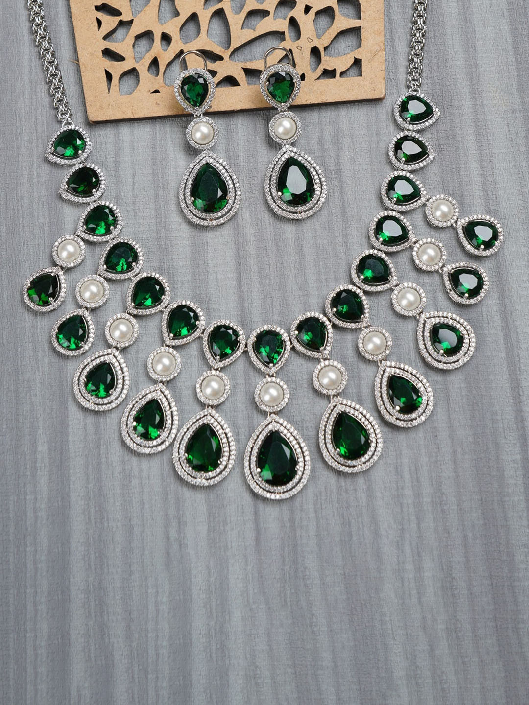 

AURAA TRENDS Rhodium-Plated Green AD & Pearl Studded Jewellery Set