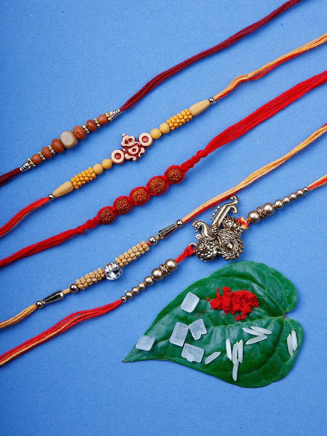 

Ariana Men Set Of 5 Red & Gold-Coloured Beaded Rakhi With Rolichawal