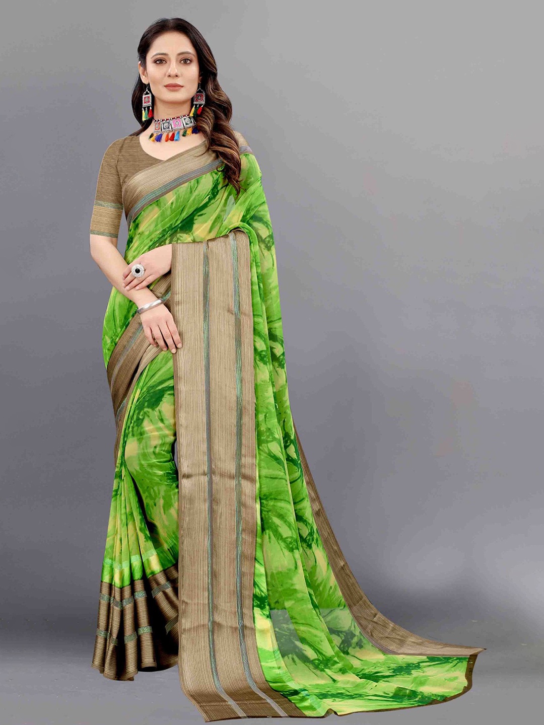 

APNISHA Green & Brown Floral Zari Pure Georgette Saree