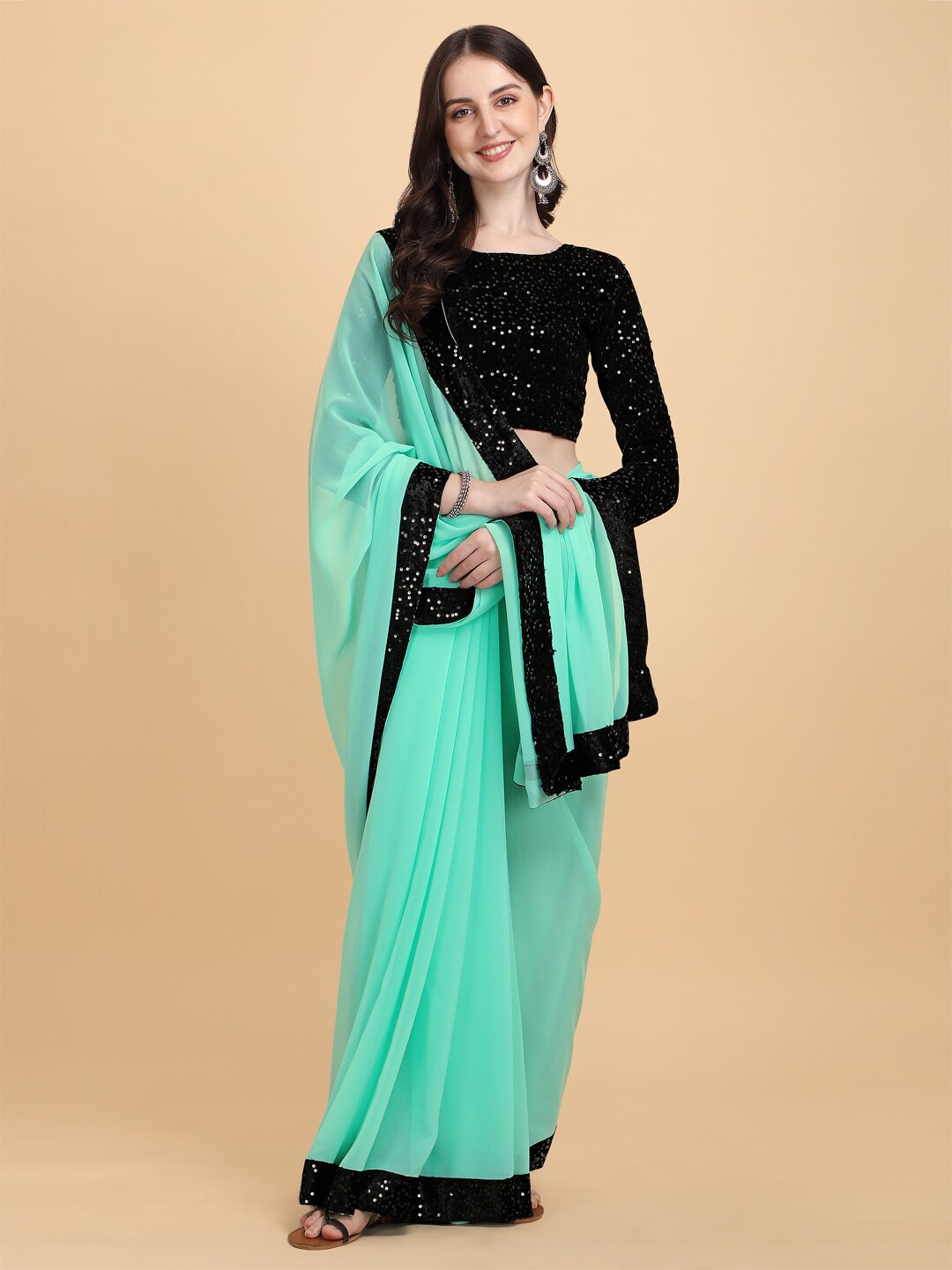 

PMD Fashion Teal & Black Embellished Sequinned Pure Georgette Saree