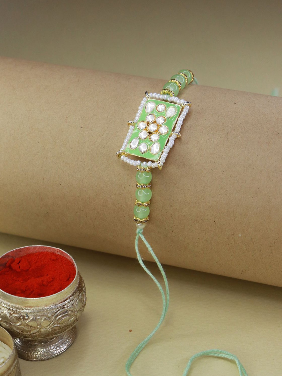 

I Jewels Gold-Toned & Green Kundan Studded Rakhi