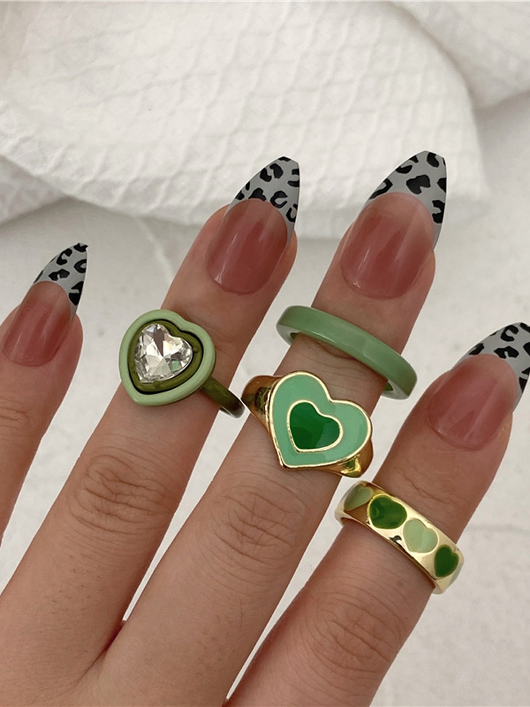 

Shining Diva Fashion Set Of 4 Gold-Plated Green Crystal-Studded Finger Ring