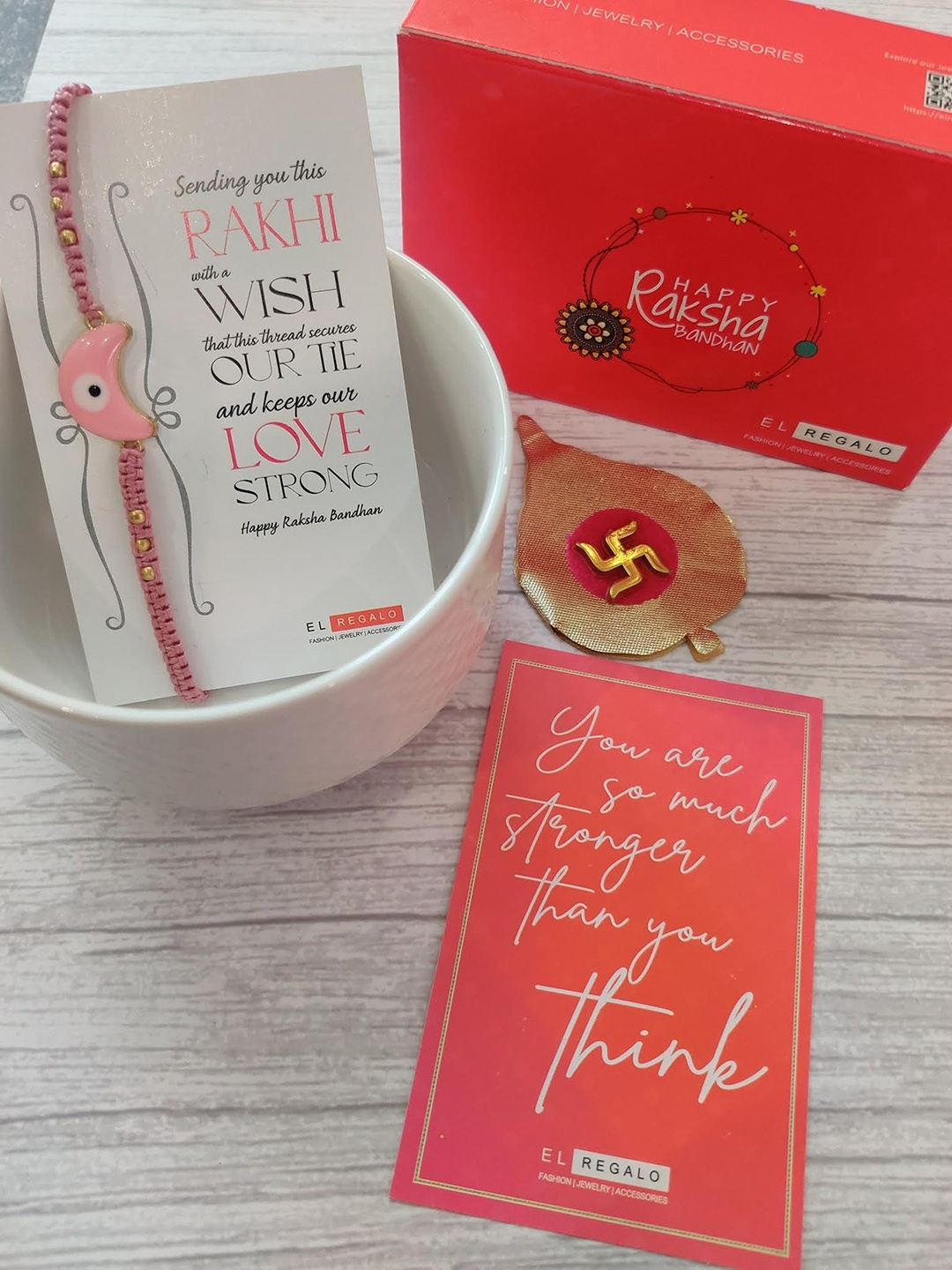 

EL REGALO Evil Eye Rakhi Combo for Bhaiya With Roli Chawal Shagun and Greeting Card, Pink