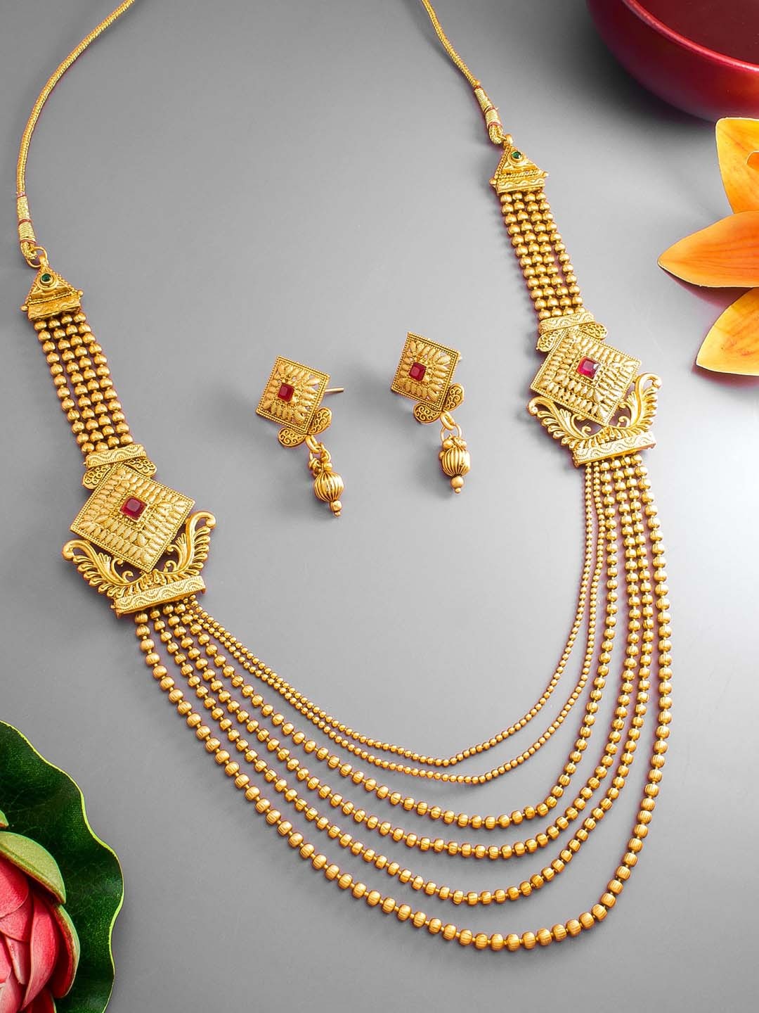 

aadita Gold-Plated Red Stone-Studded & Beaded Jewellery Set