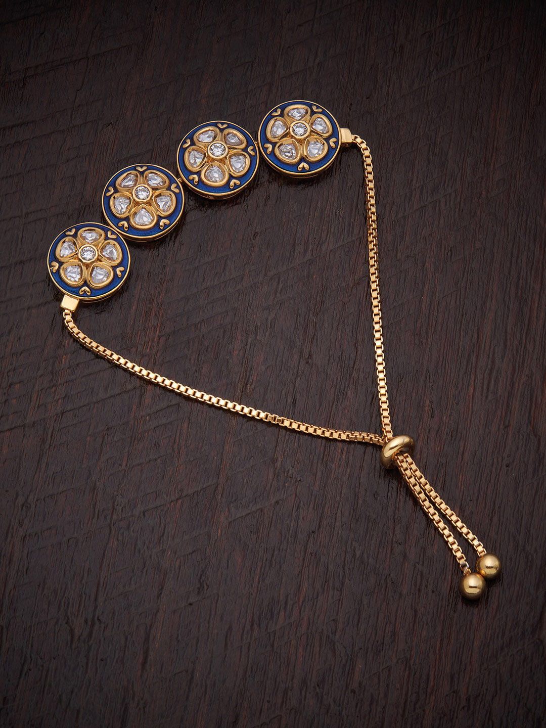 

Kushal's Fashion Jewellery Women Gold-Toned & White Kundan Enamelled Gold-Plated Wraparound Bracelet