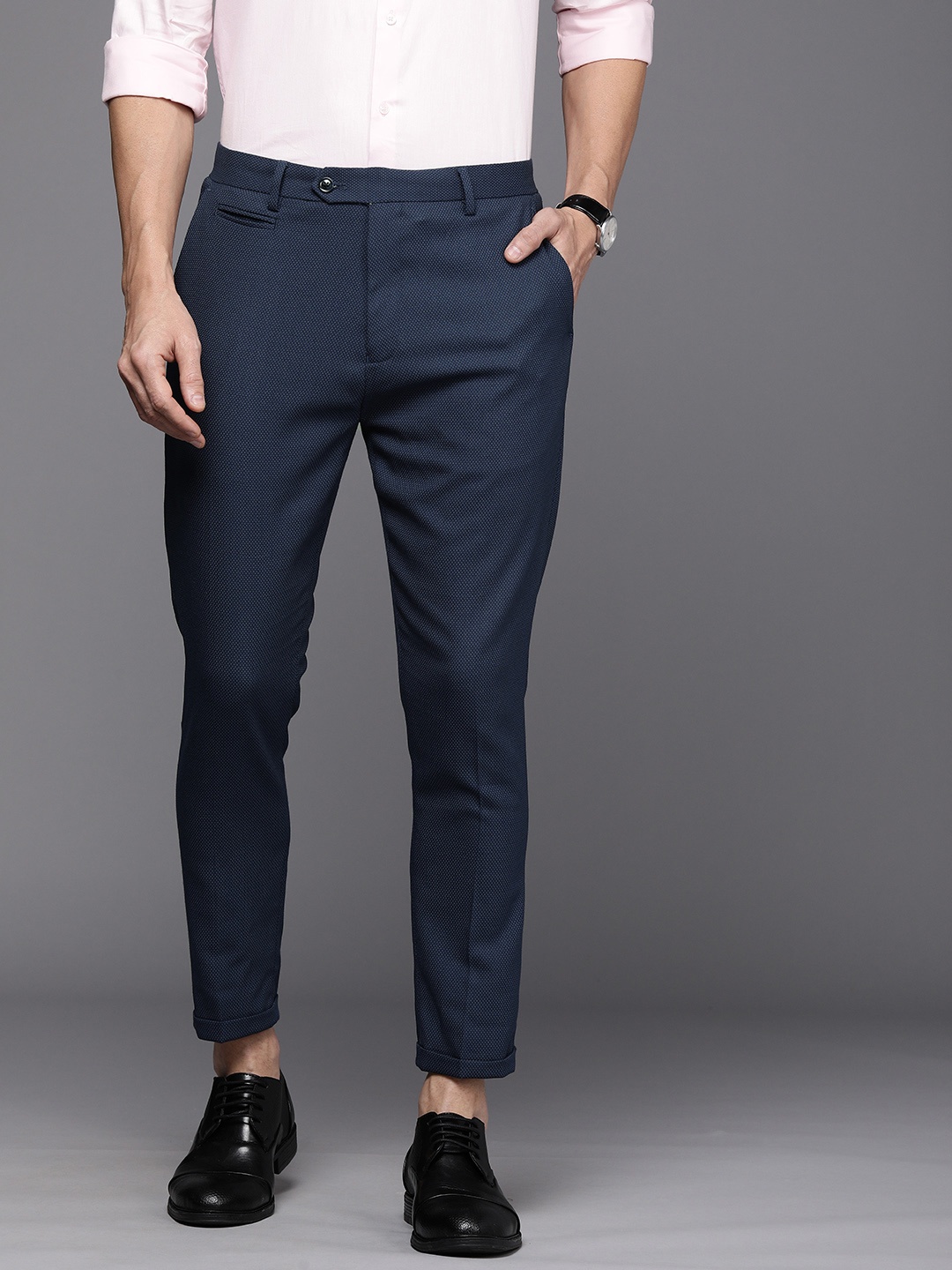 

Peter England Elite Men Blue Carrot Fit Trousers, Navy blue