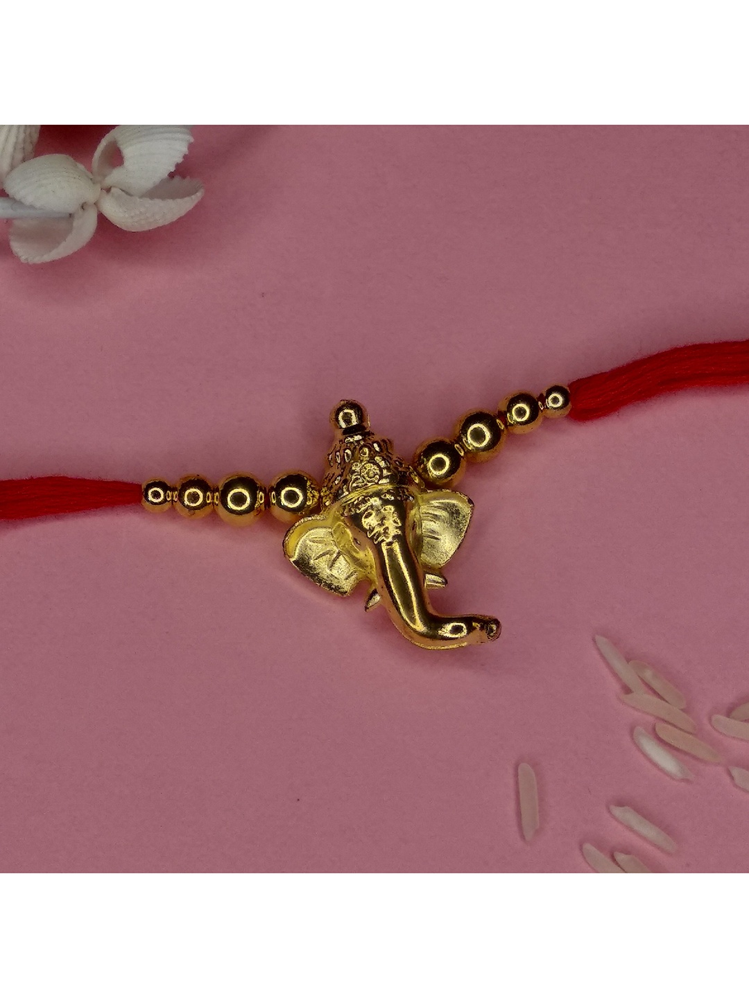 

CRAYTON Gold Toned & Maroon Ganesha Thread Rakhi