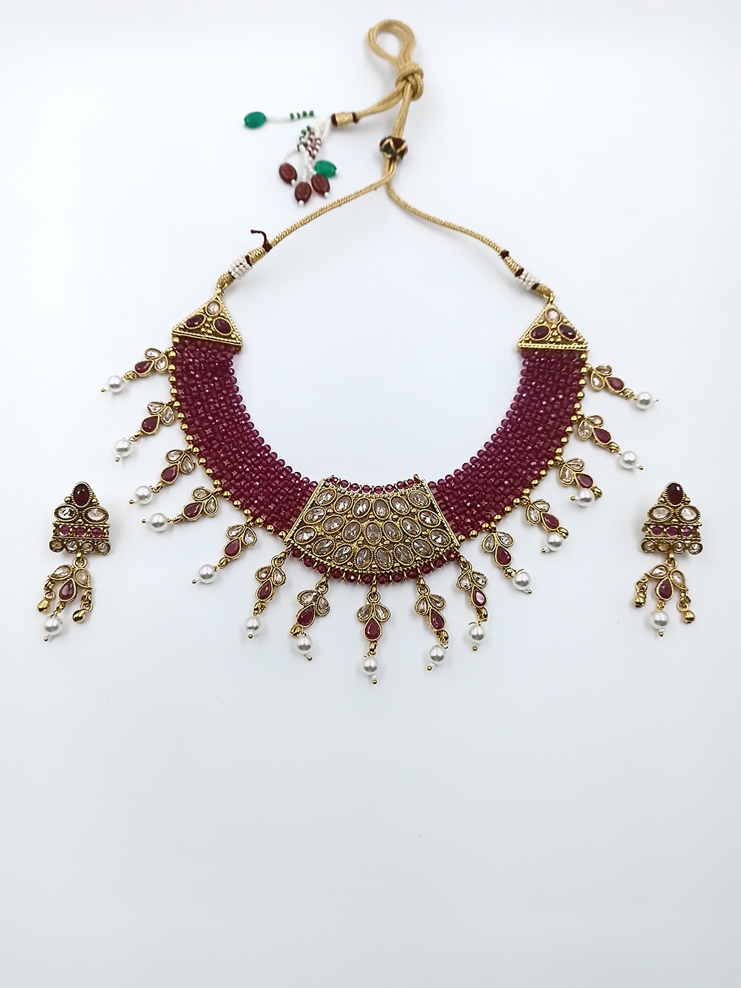 

StileAdda Gold-Plated Red Onyx Studded & Kundan Beaded Jewellery Set