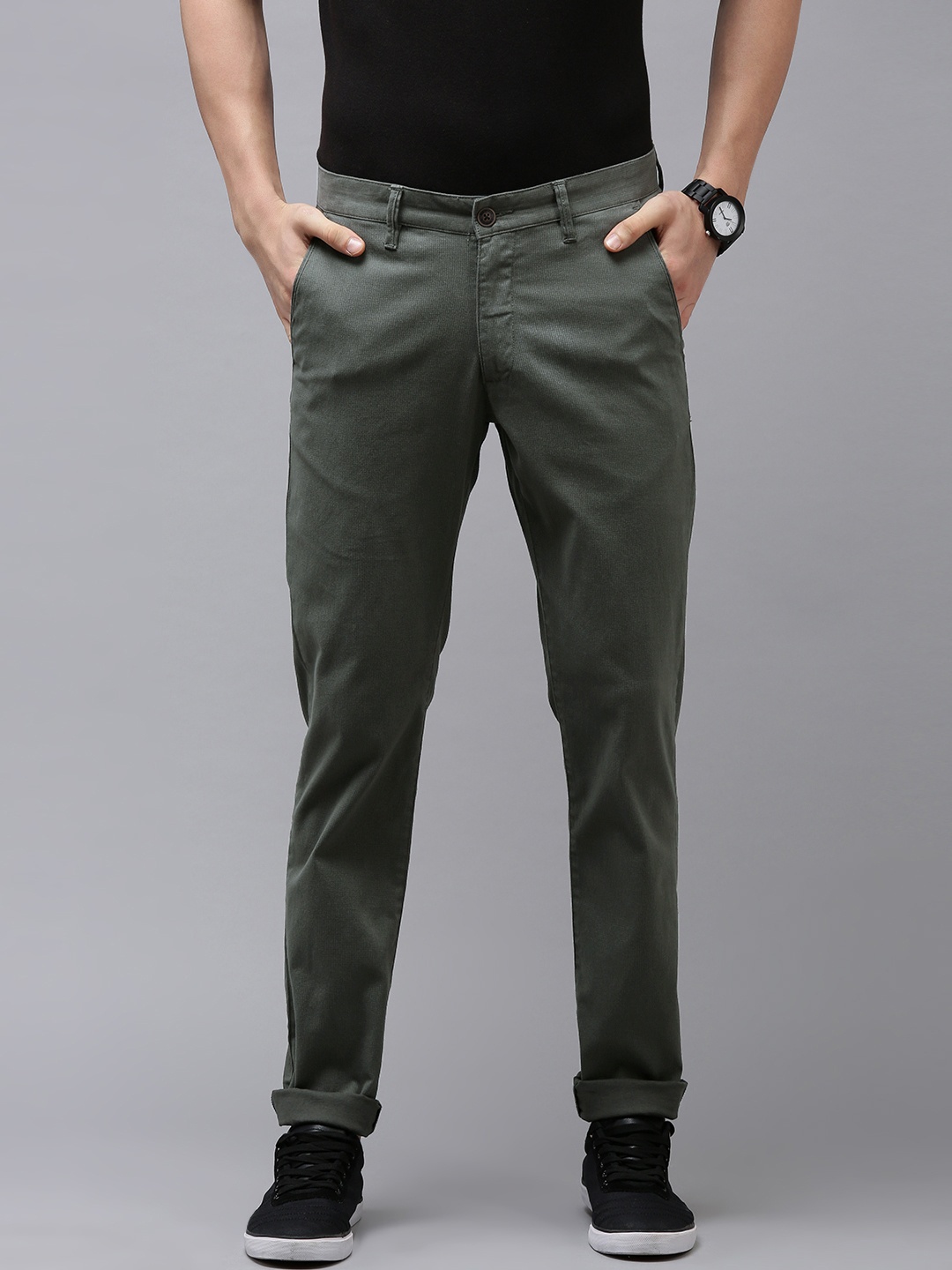 

Van Heusen Sport Men Olive Green Self Design Textured Tapered Fit Mid-Rise Plain Trousers