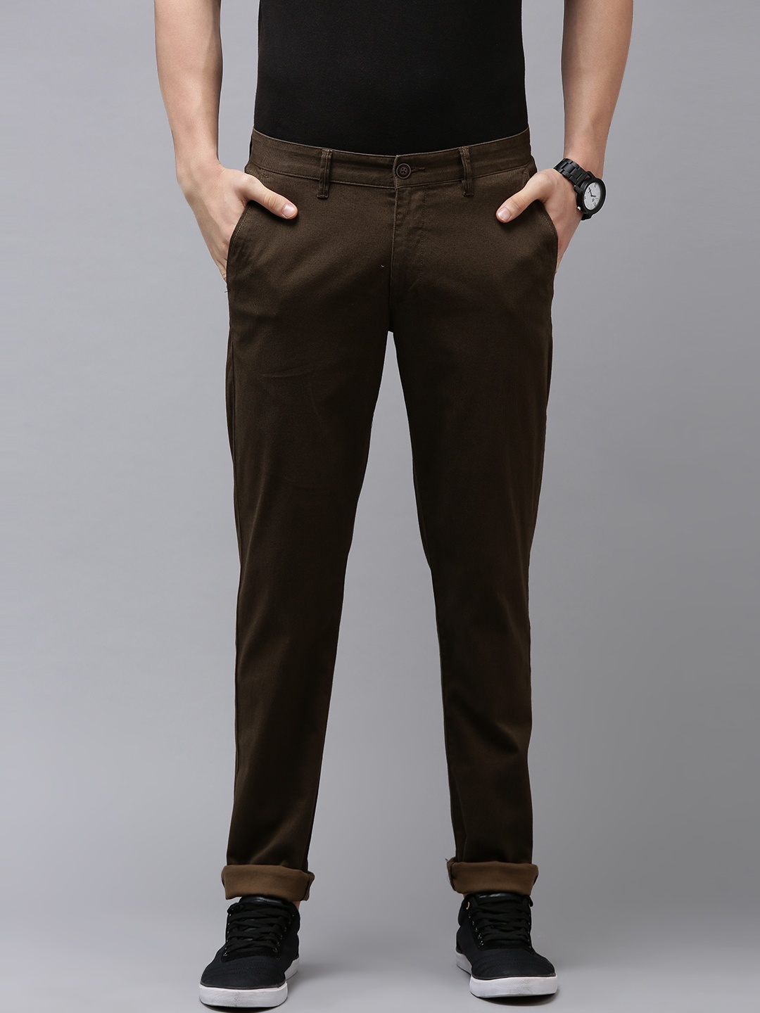 

Van Heusen Sport Men Brown Self Design Textured Tapered Fit Mid-Rise Plain Woven Trousers