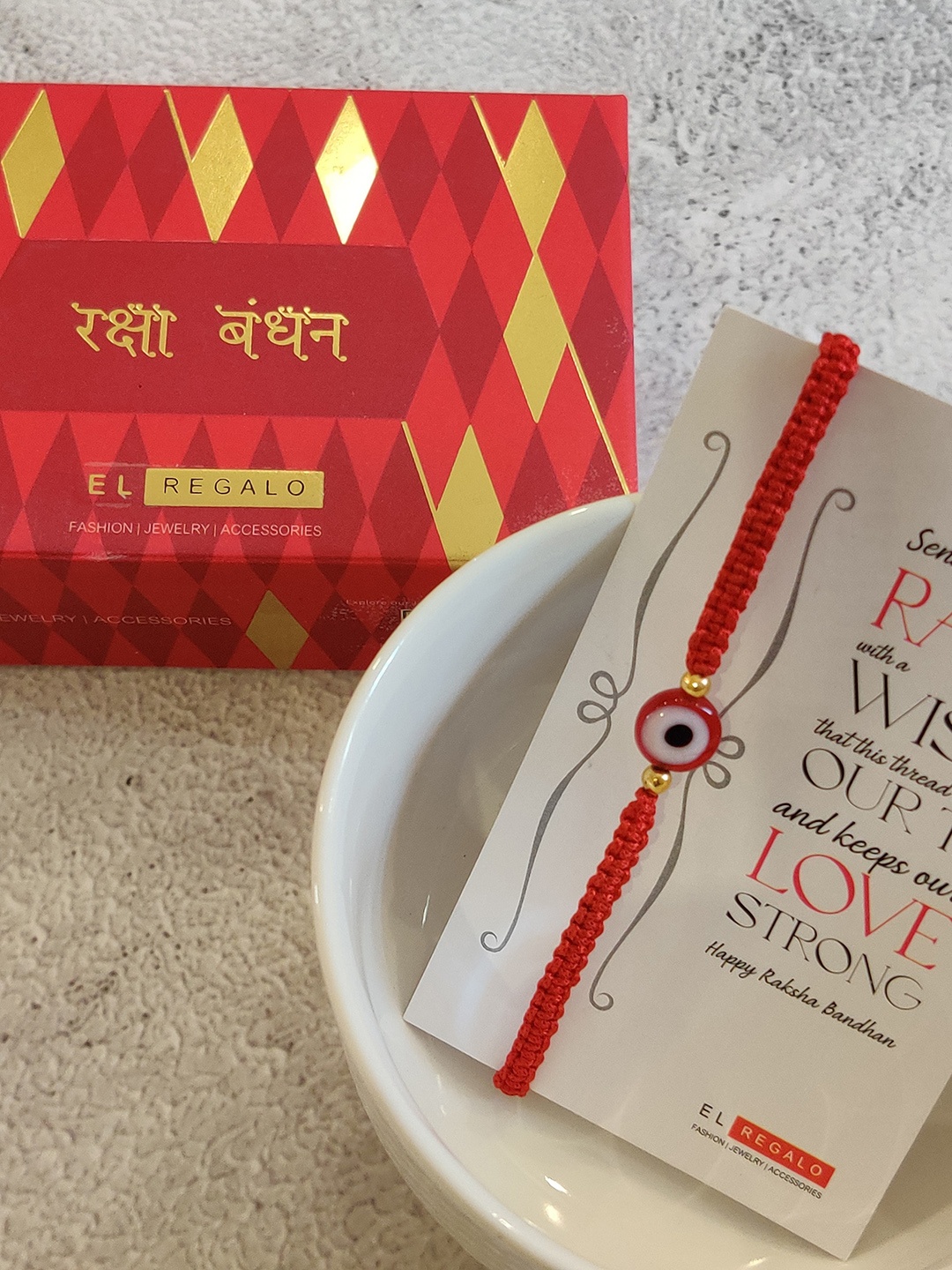 

EL REGALO Red & Gold-Toned Beaded Thread Rakhi & Greeting Card Set