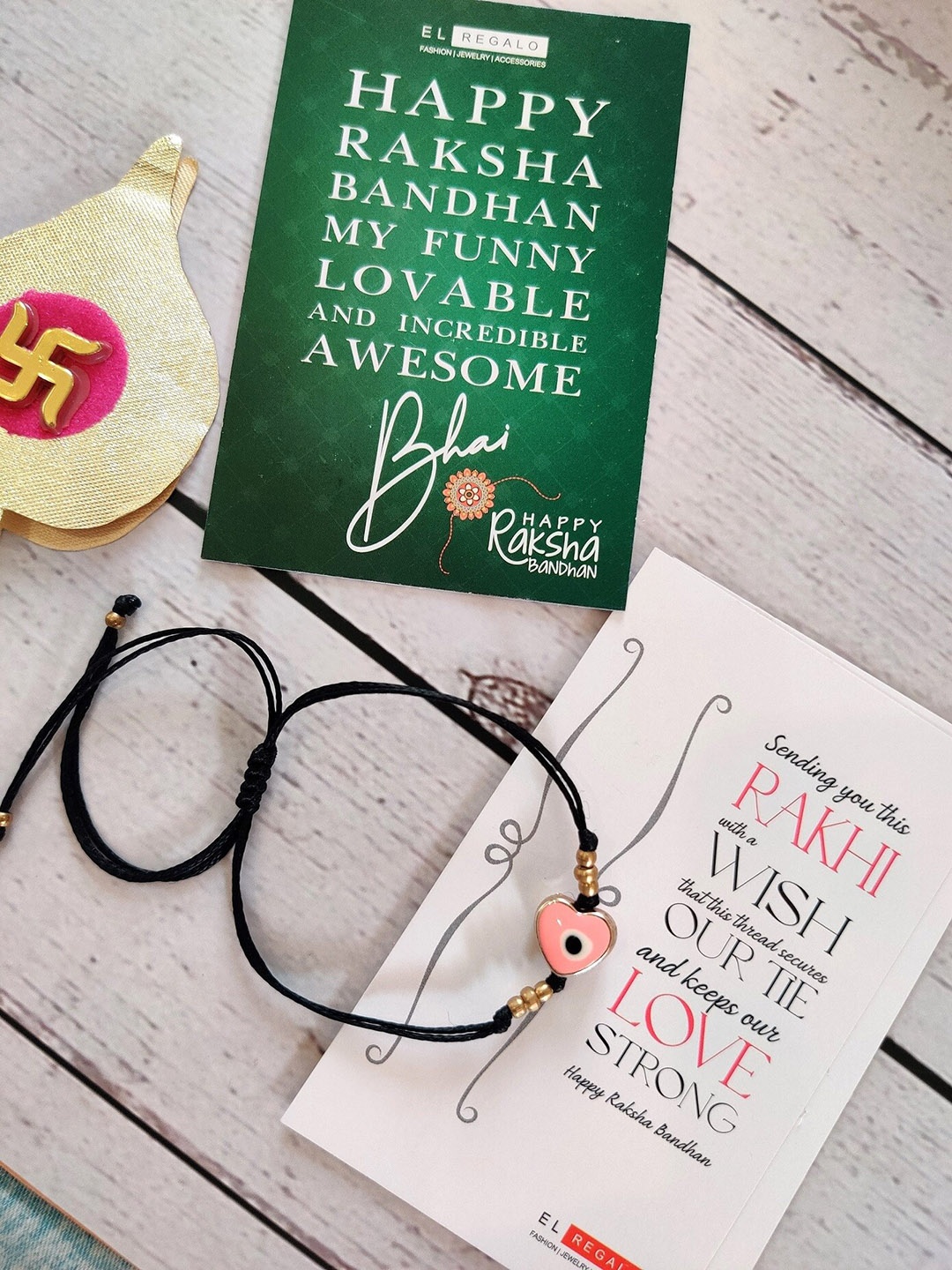 

EL REGALO Pink & Black Evil Eye Rakhi with Card and Roli Chawal