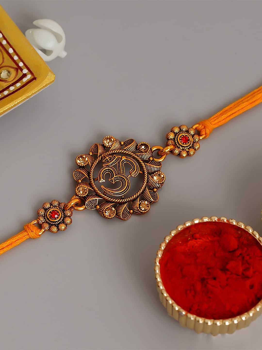 

eCraftIndia Orange Religious Om Rakhi & Roli Chawal