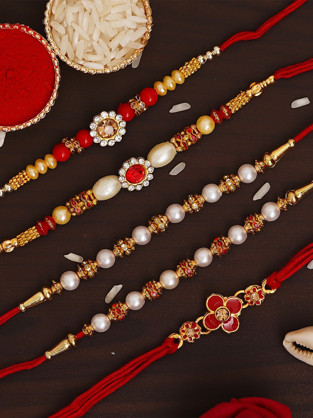

eCraftIndia Set of 5 Red & Gold-Toned Pearl Designer Rakhi with Roli Chawal Pack, Multi