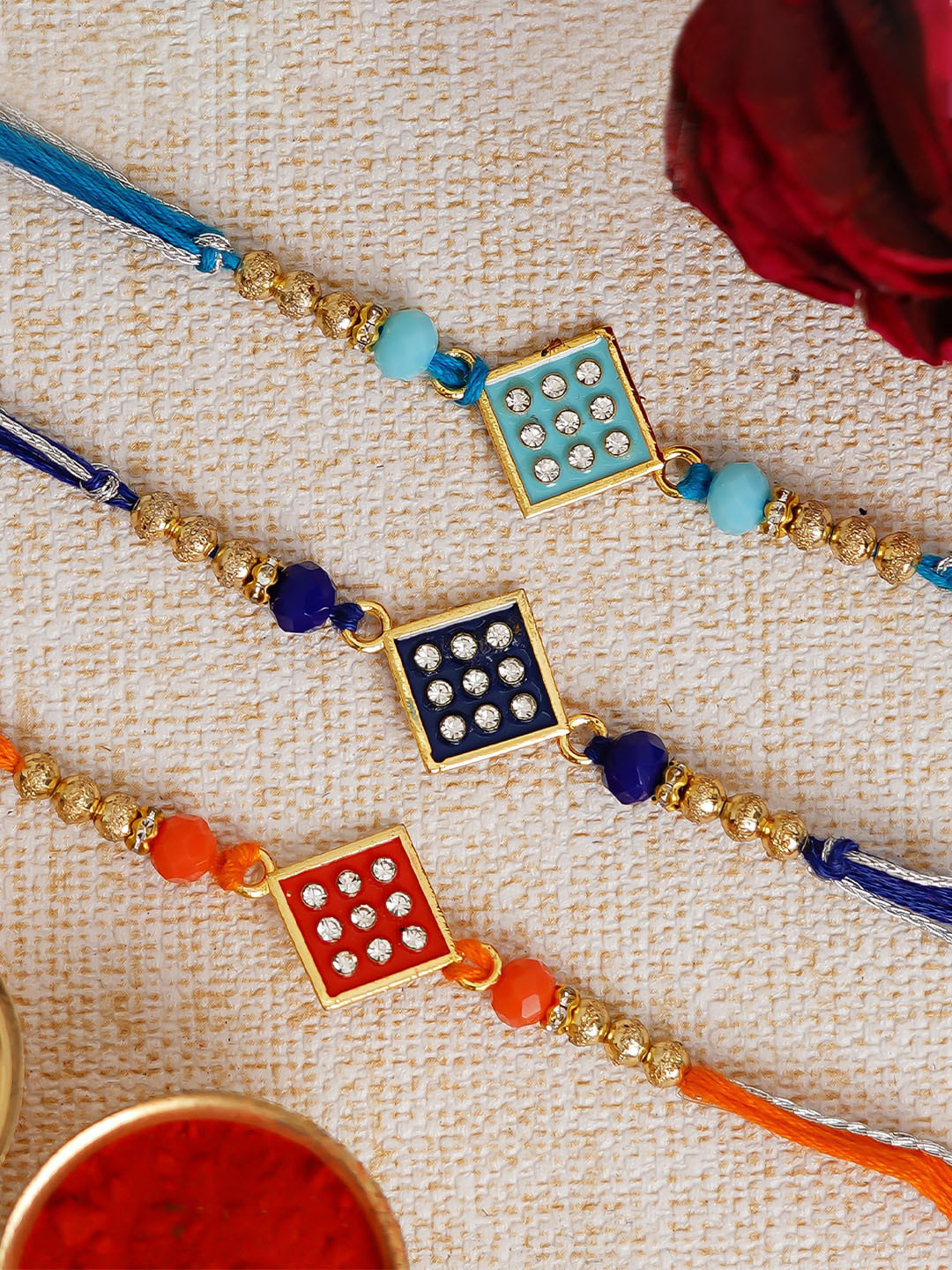 

eCraftIndia Pack of 3 Designer Rakhis & Roli Chawal, Red