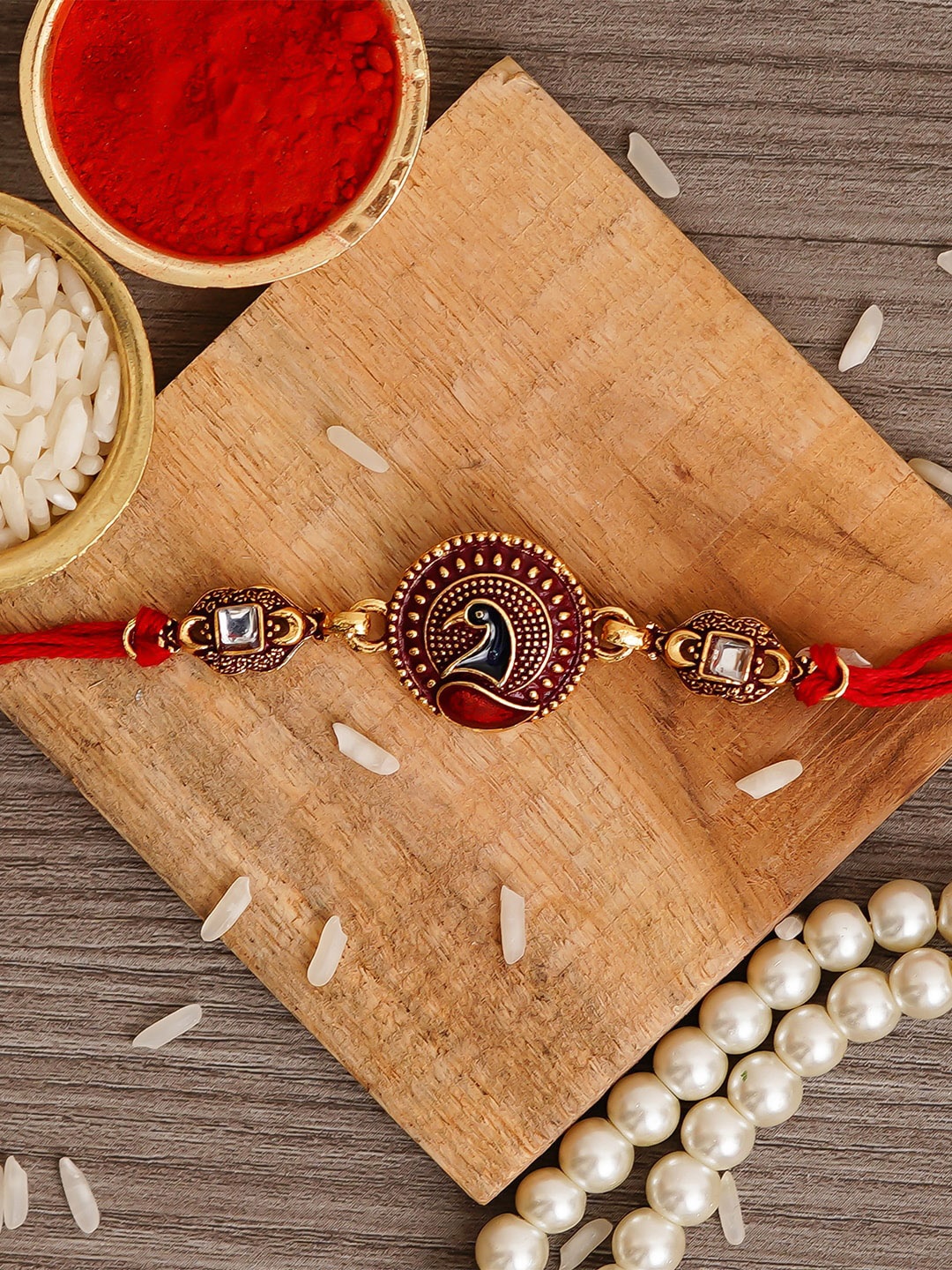 

eCraftIndia Gold & Red Peacock Designer Rakhi and Roli Chawal Pack