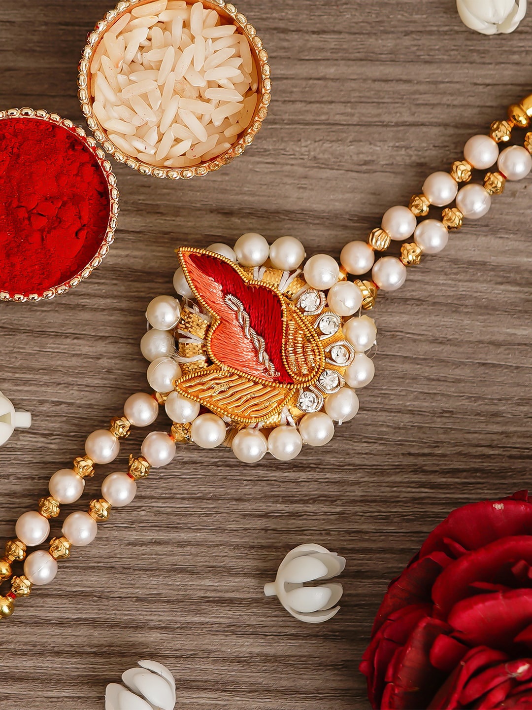 

eCraftIndia Peach Colored & Red Designer Pearl Thread Rakhi