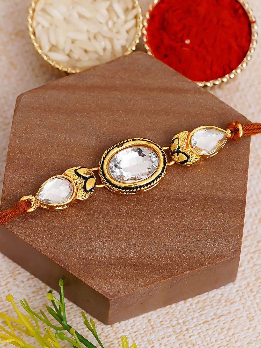 

eCraftIndia White & Gold-Toned Kundan Studded Rakhi