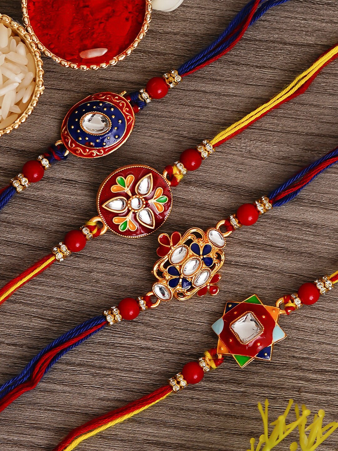 

eCraftIndia Pack Of 4 Red Designer Meenakari Rakhis & Roli Chawal