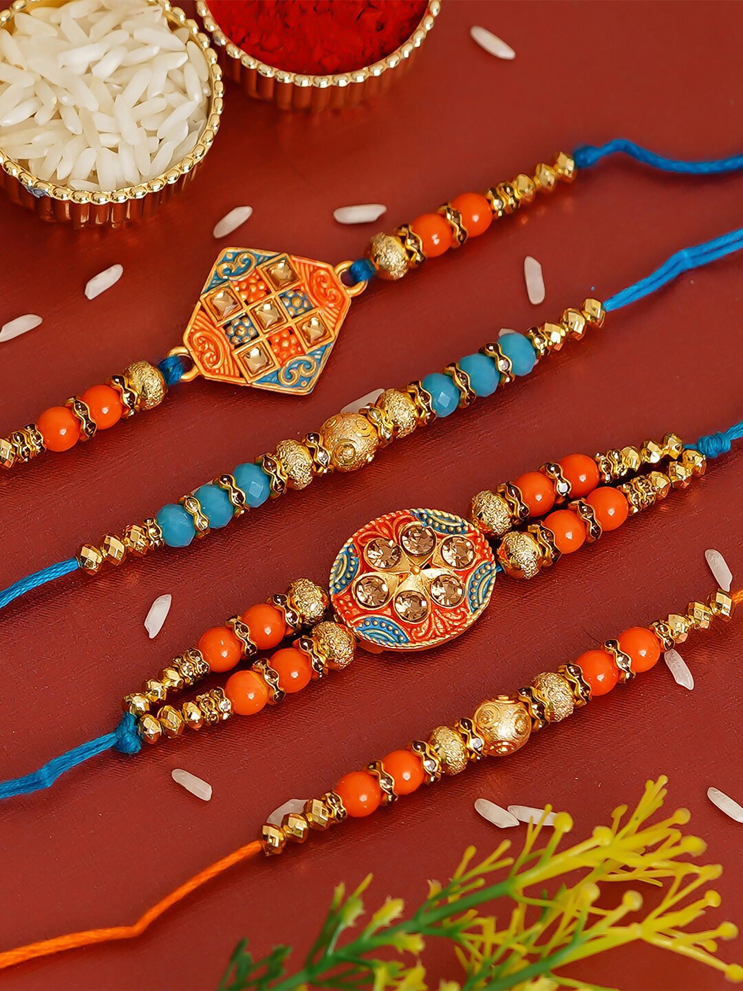 

eCraftIndia Set of 4 Blue & Orange Designer Pearl Rakhi with Roli Chawal