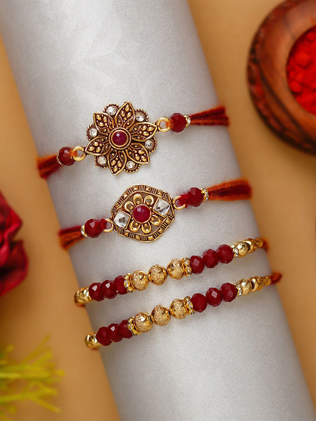 

eCraftIndia Pack of 4 Designer Rakhis and Roli Chawal, Red