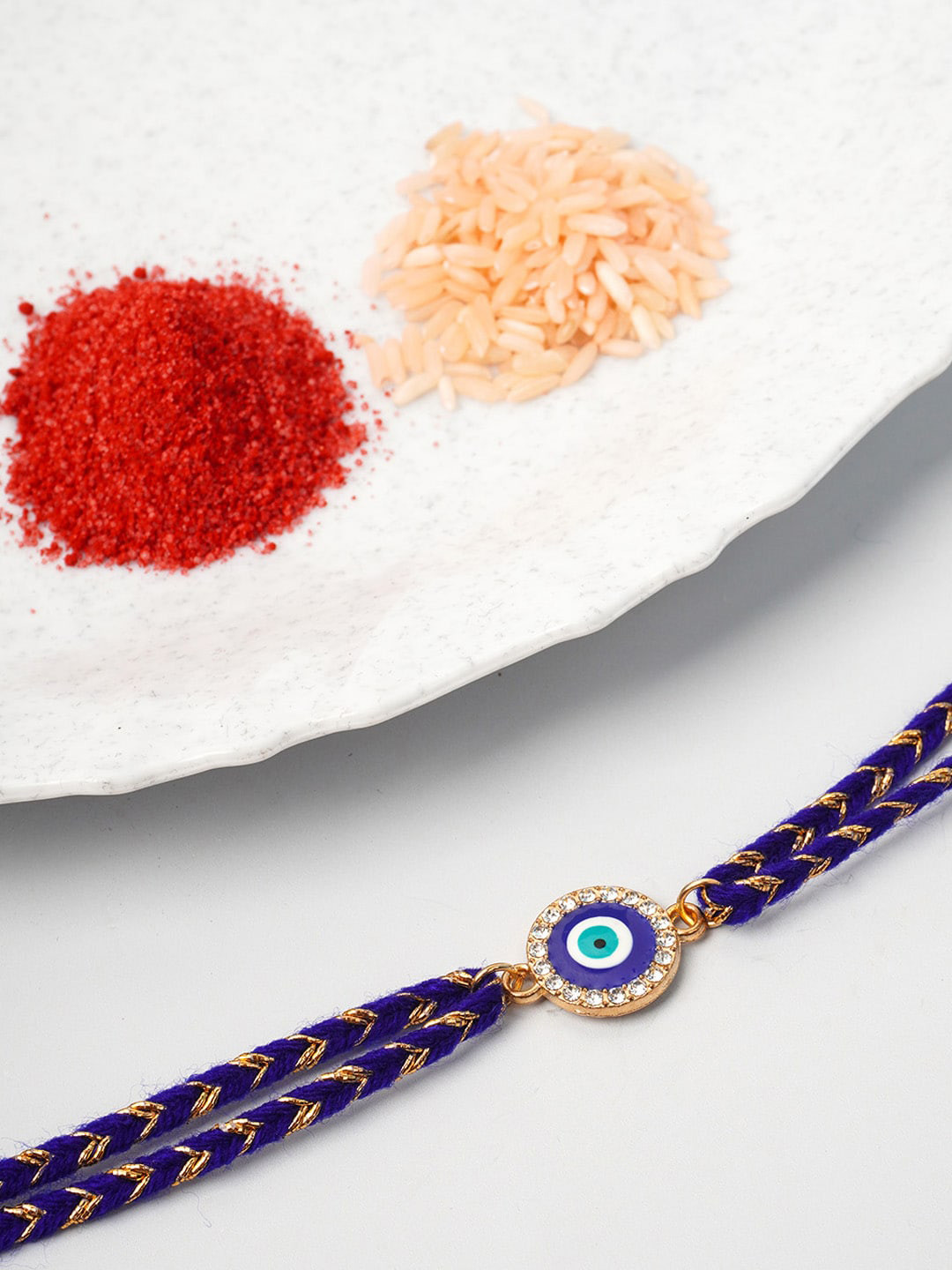 

Ferosh Blue Rose Gold-toned Crystal Round Evil Eye Rakhi