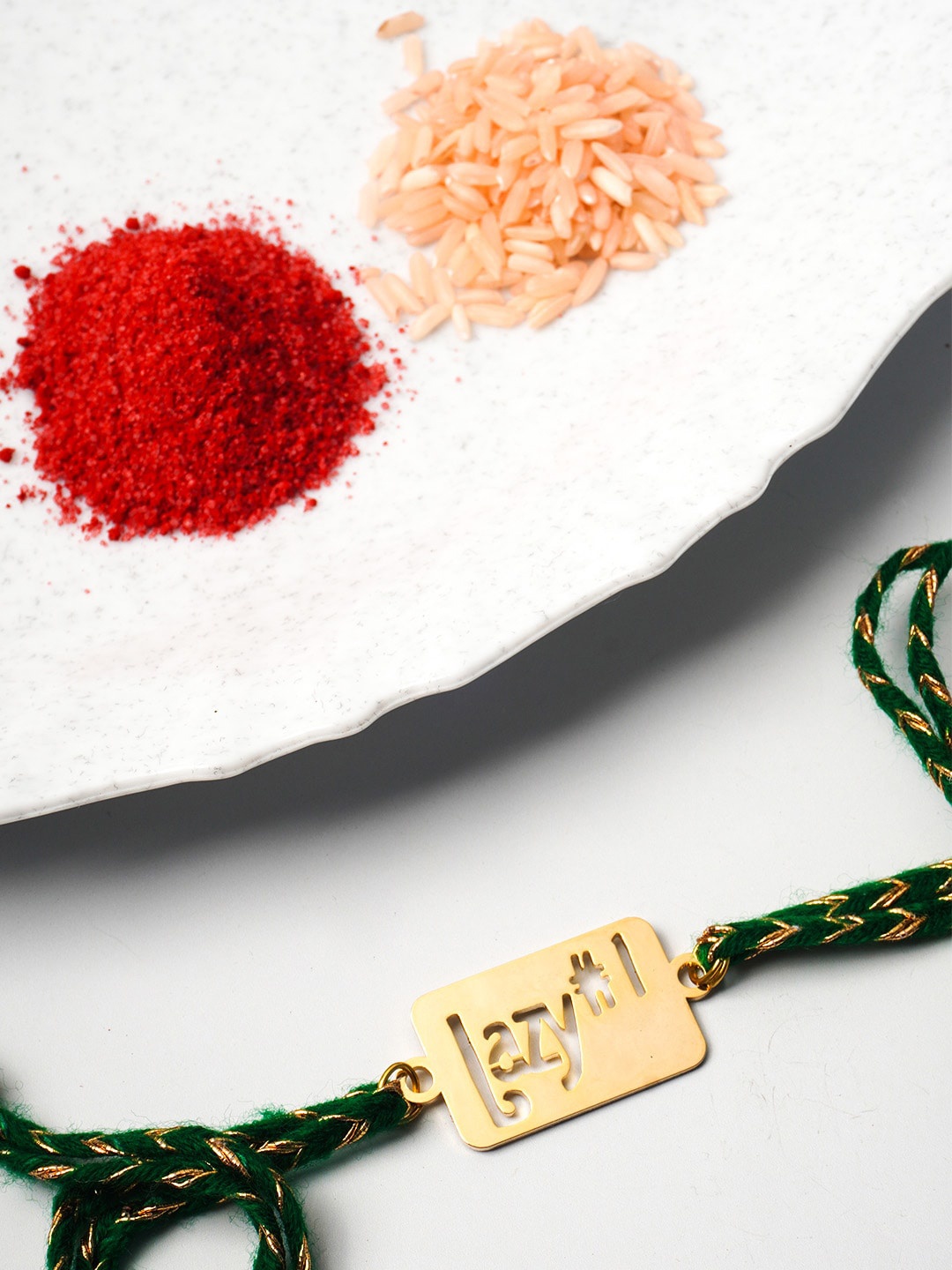 

Ferosh Men Gold Toned & Green Lazy No. 1 Beaded Rakhi