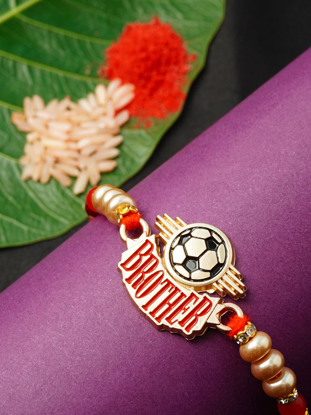 

Ferosh Men Gold-Toned & Red Thread Rakhi With Roli Chawal