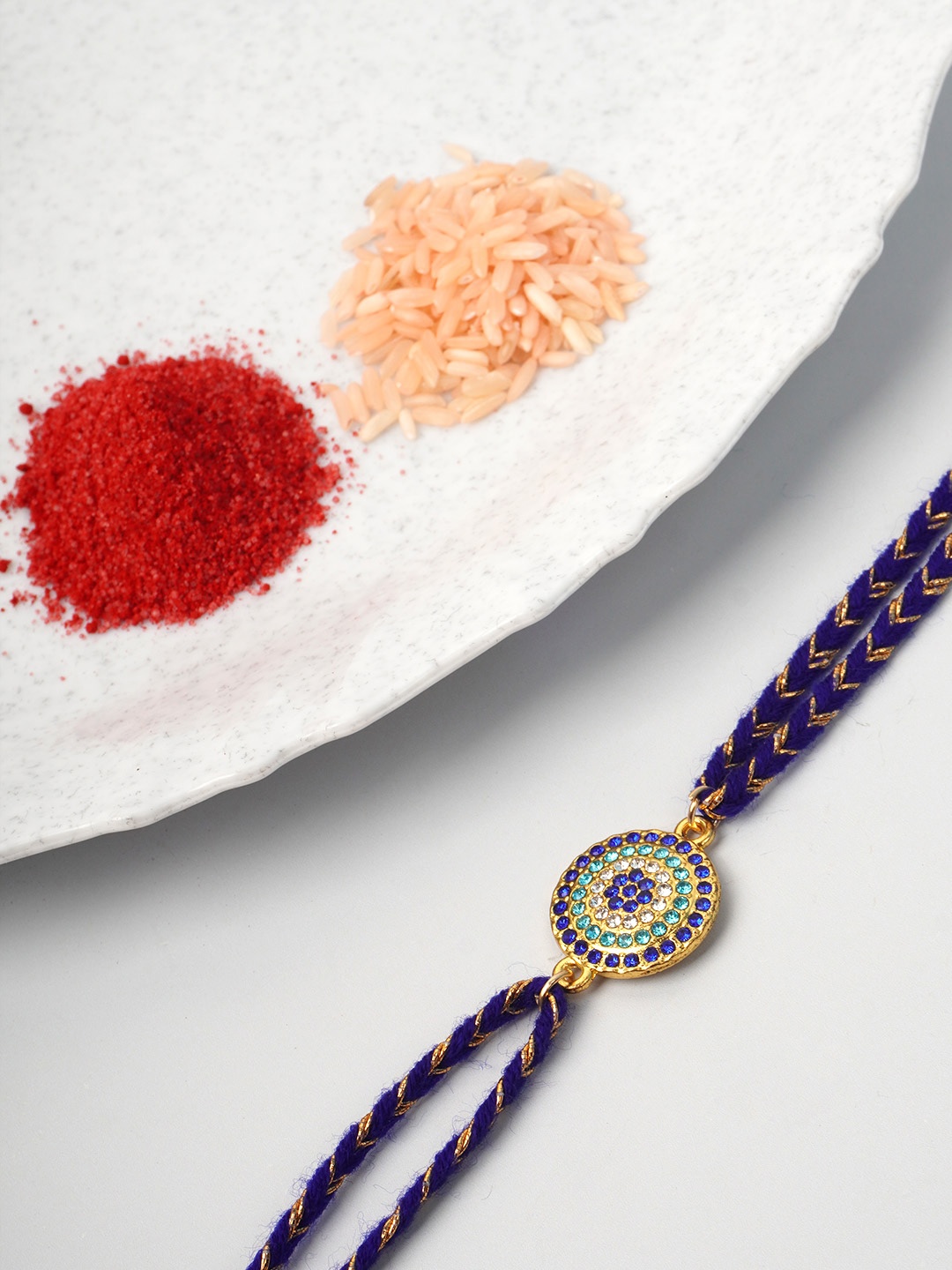 

Ferosh Men Blue & Green Evil Eye Crystal Studded Thread Rakhi With Roli Chawal