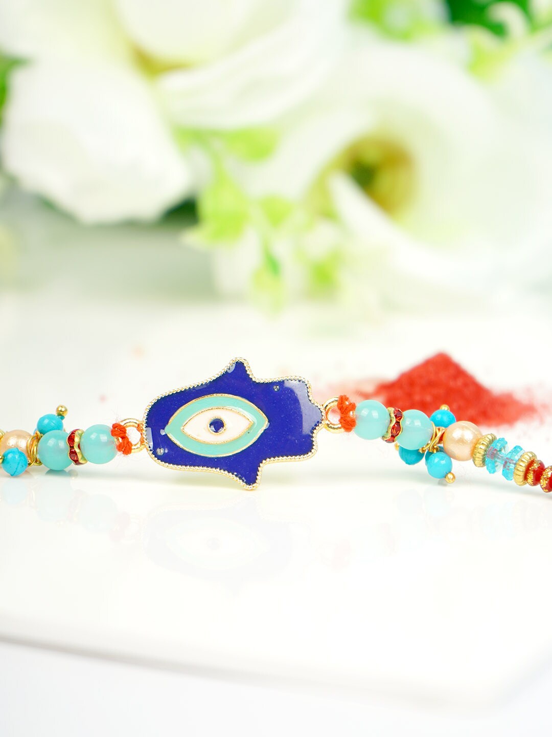 

Ferosh Men Blue & White Hamsa Hand Charm Rakhi With Roli Chawal