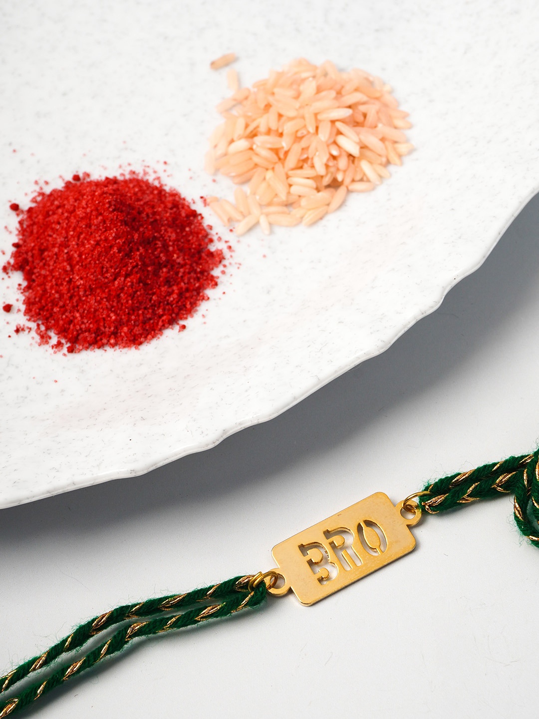 

Ferosh Men Gold-Toned & Green Bro Rakhi Set With Sindoor & Chawal