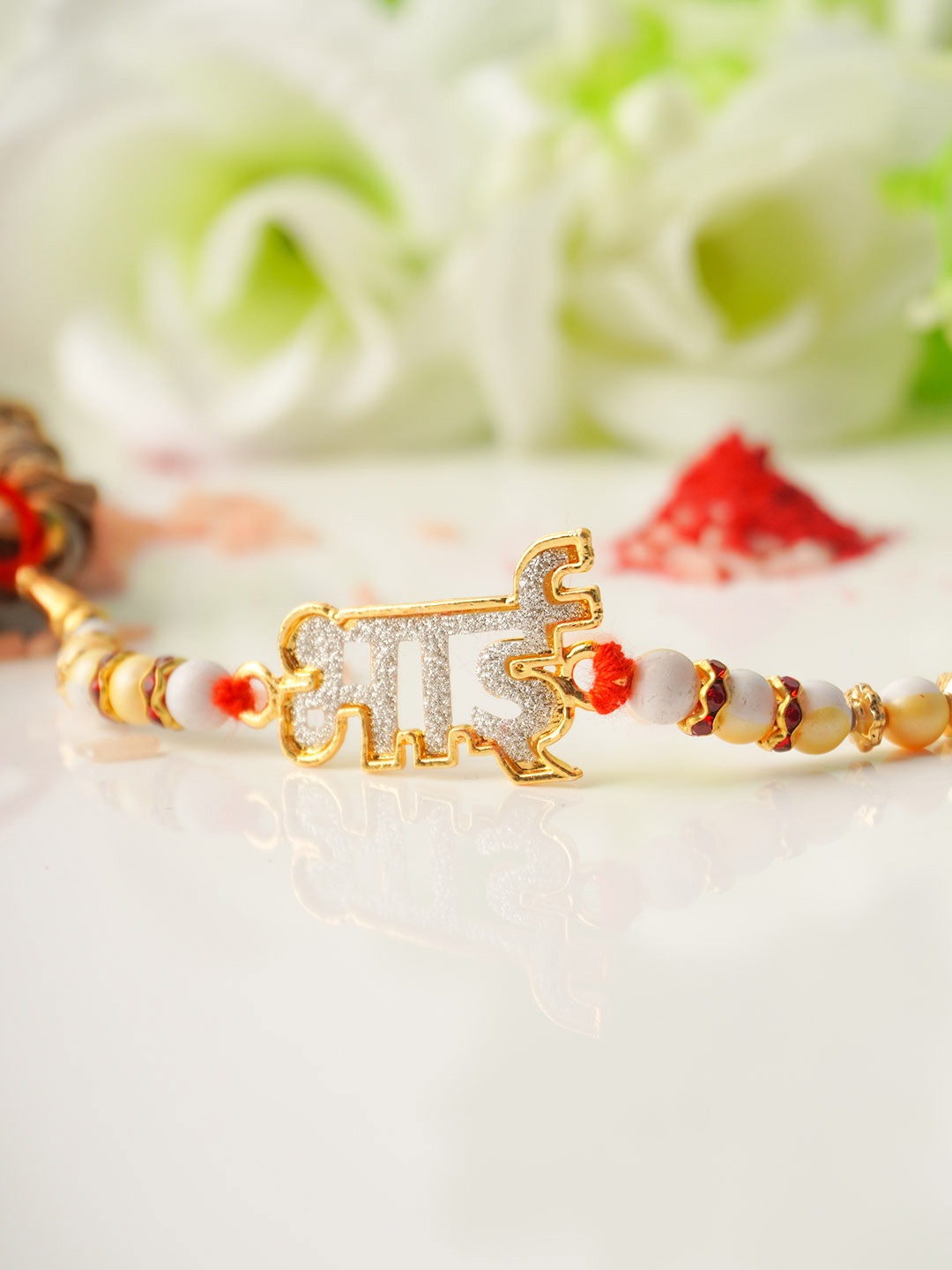 

Ferosh Men Gold-Toned & White Glitter Bhai Text Rakhi
