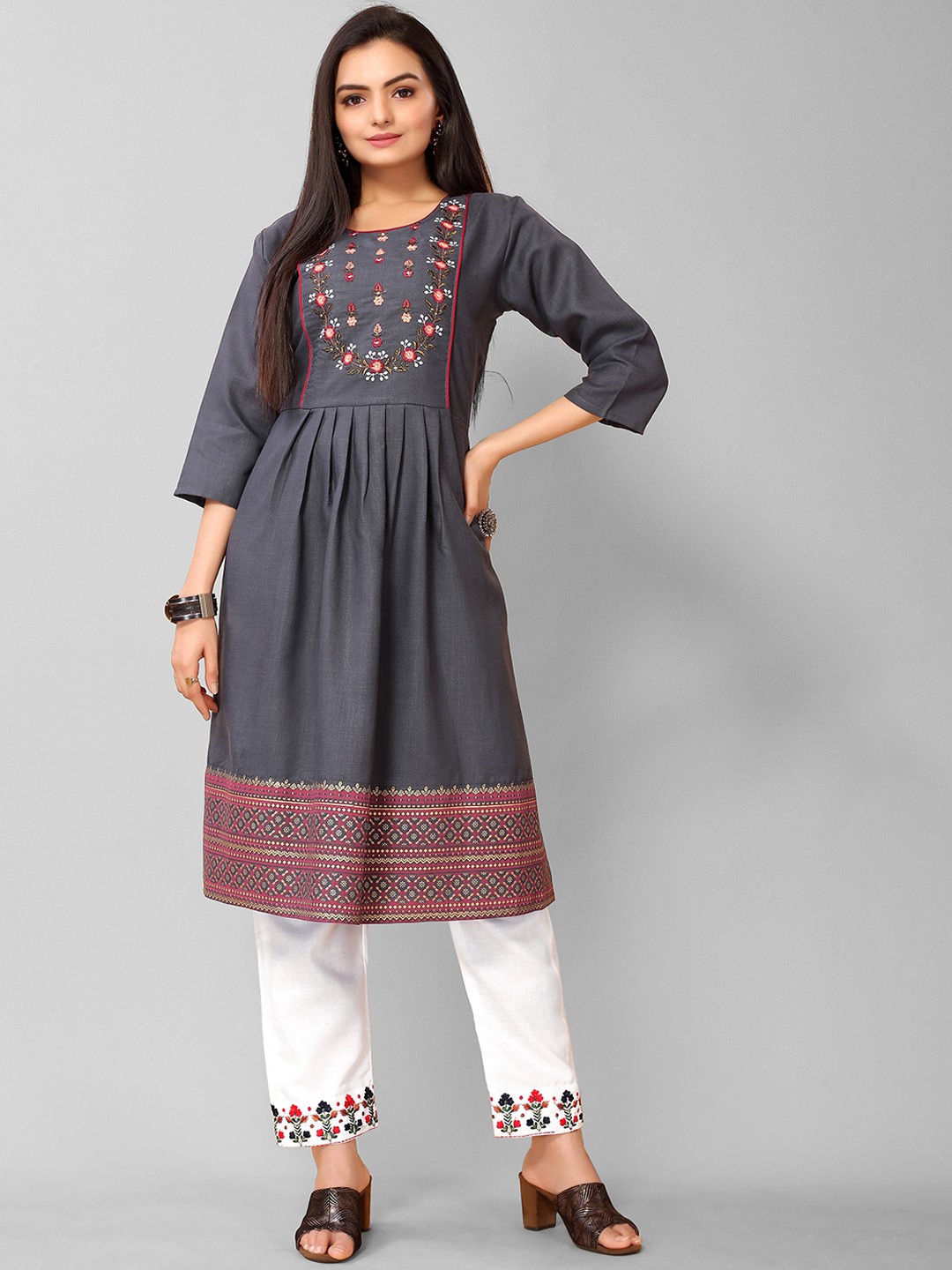 

KALINI Women Teal Floral Embroidered Pleated Thread Work Kurti with Trousers