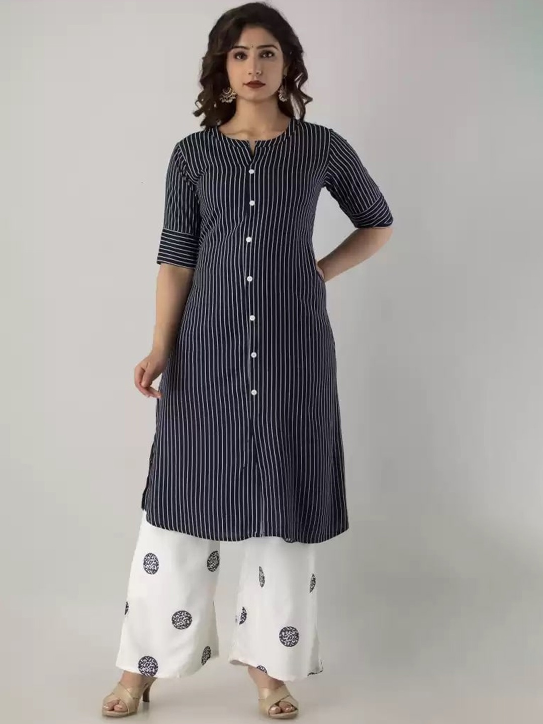 

Meeranshi Women Navy Blue Striped Pleated Beads and Stones Kurti with Skirt