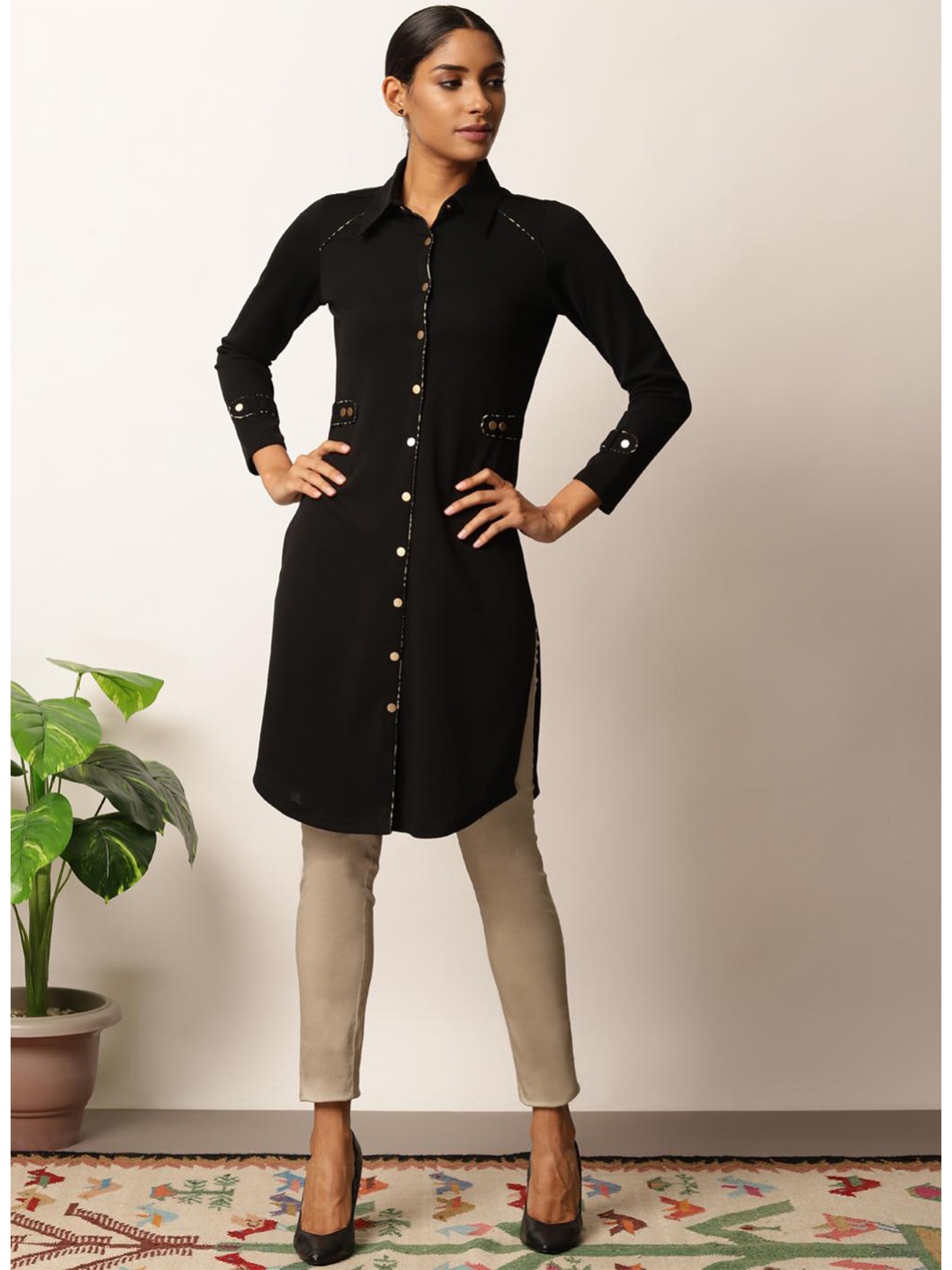 

Lakshita Black Solid Shirt Collar Kurti