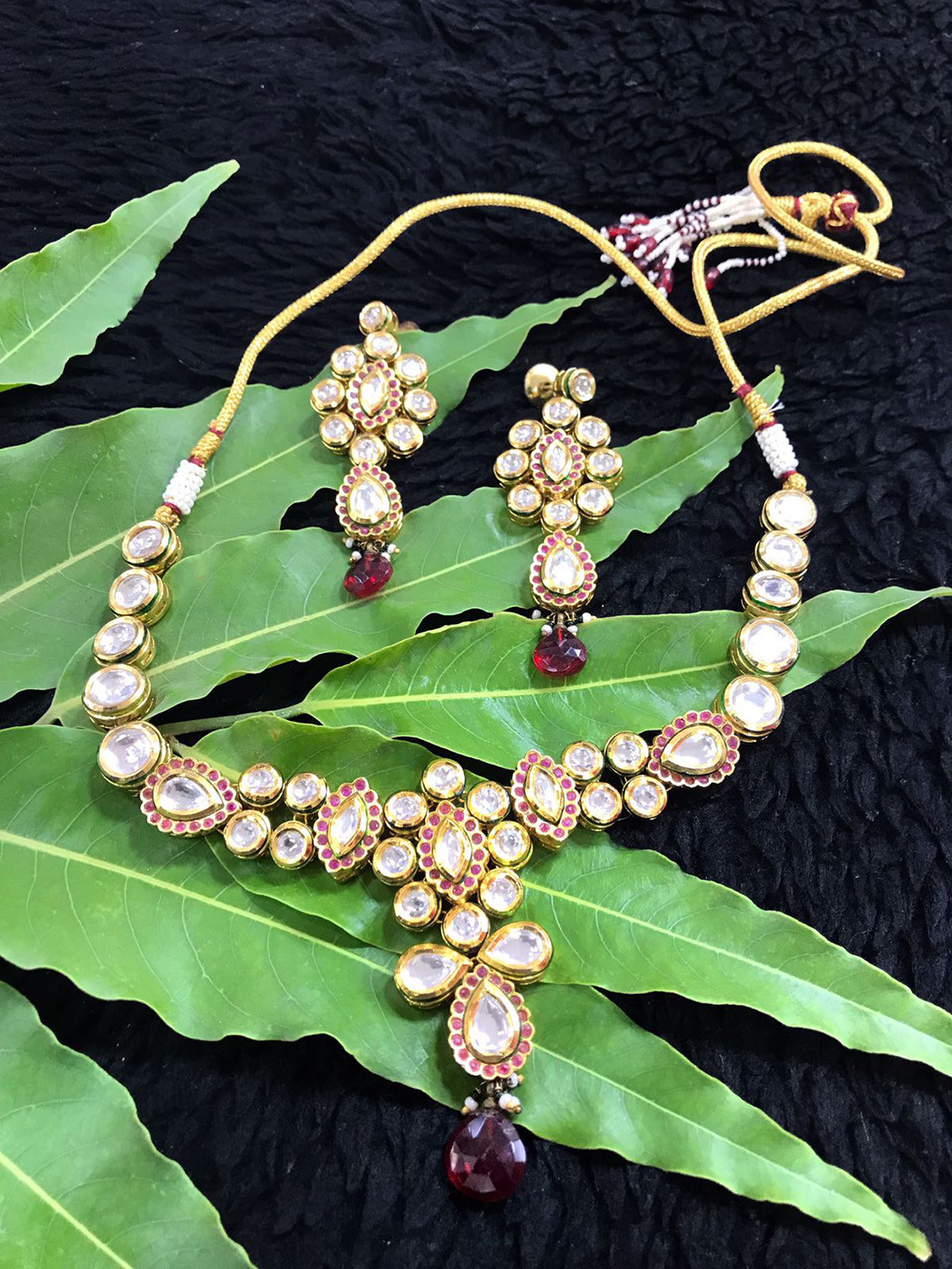 

SURYAM DESIGNER JEWELLERY Gold-Plated White Kundan-Studded Jewellery Set