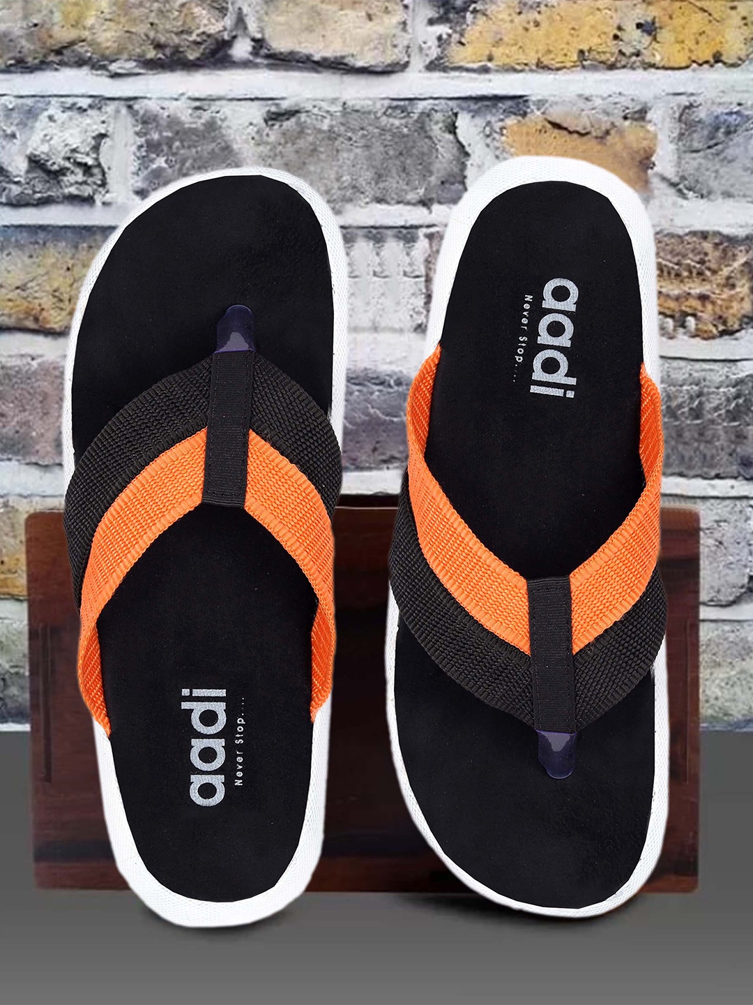 

aadi Men Black & Orange Slip-On
