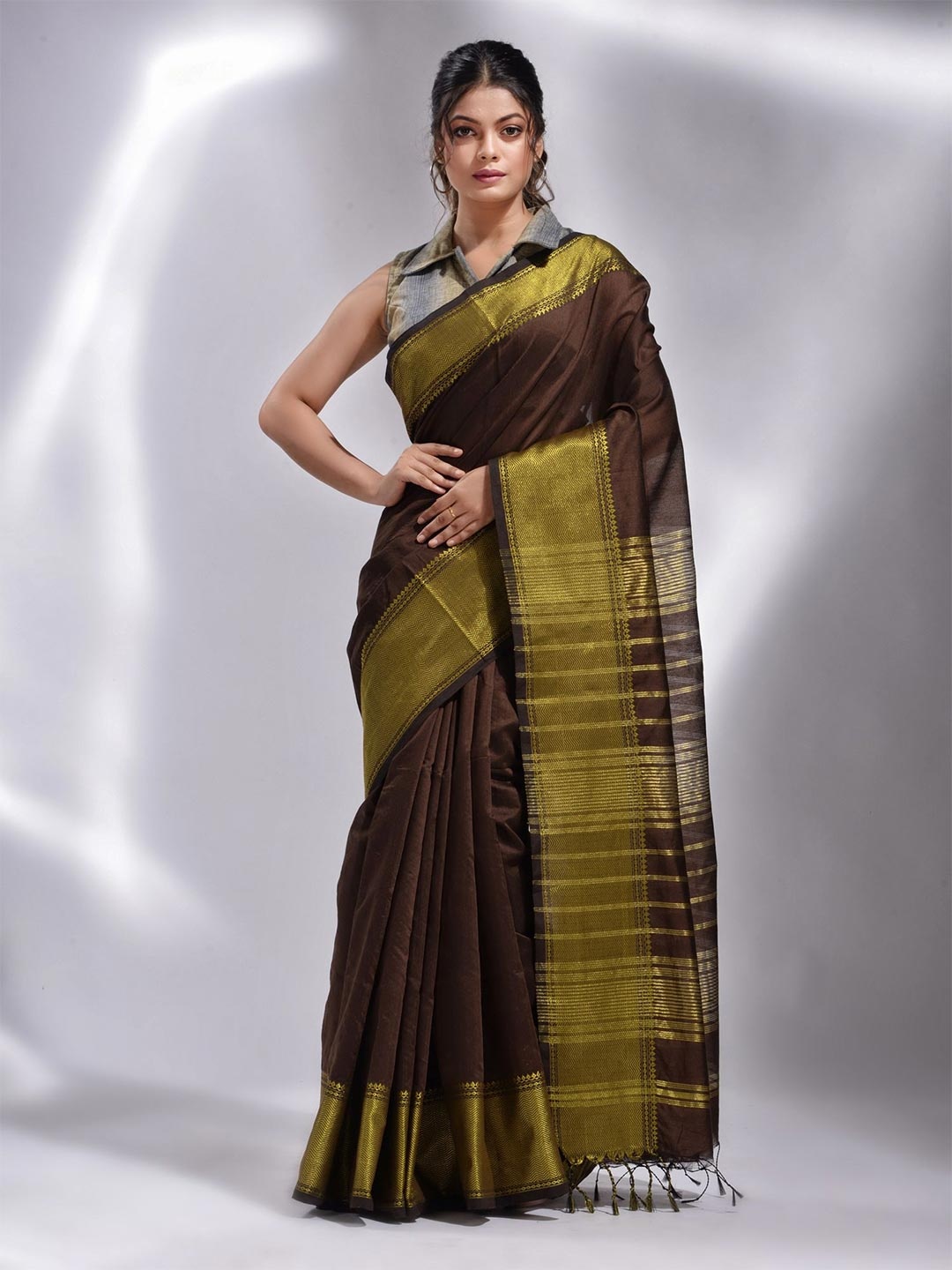 

Charukriti Brown & Gold-Toned Woven Design Saree