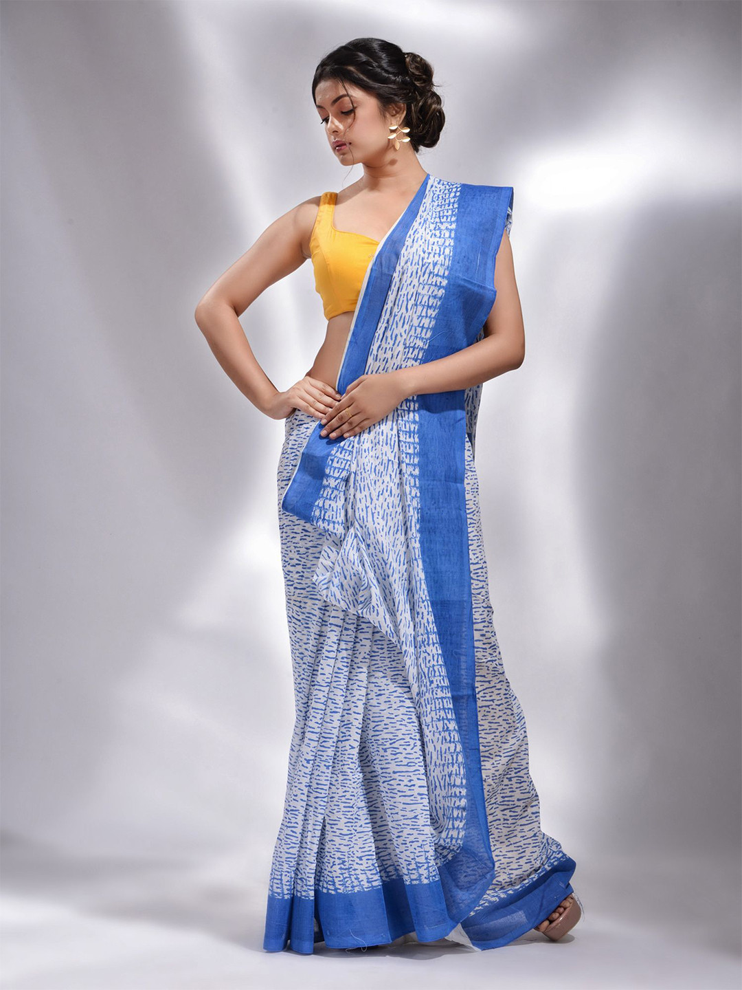 

Charukriti White & Blue Pure Cotton Saree