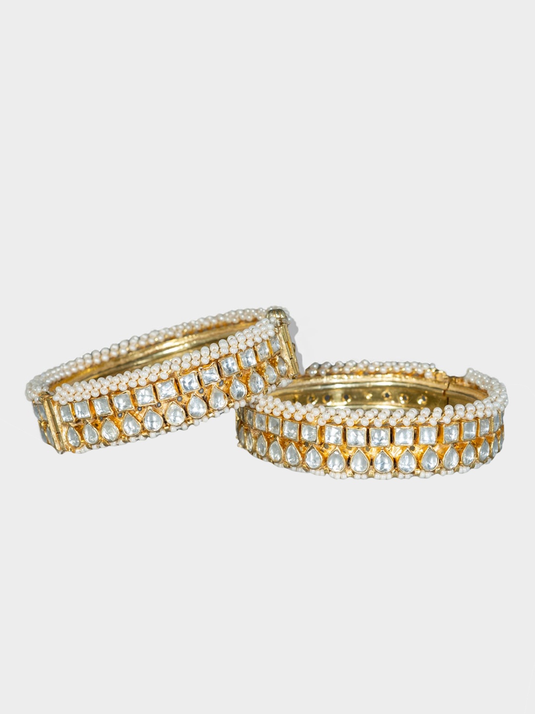 

AURAA TRENDS Set Of 2 Gold-Plated & White Kundan -Studded Bangles