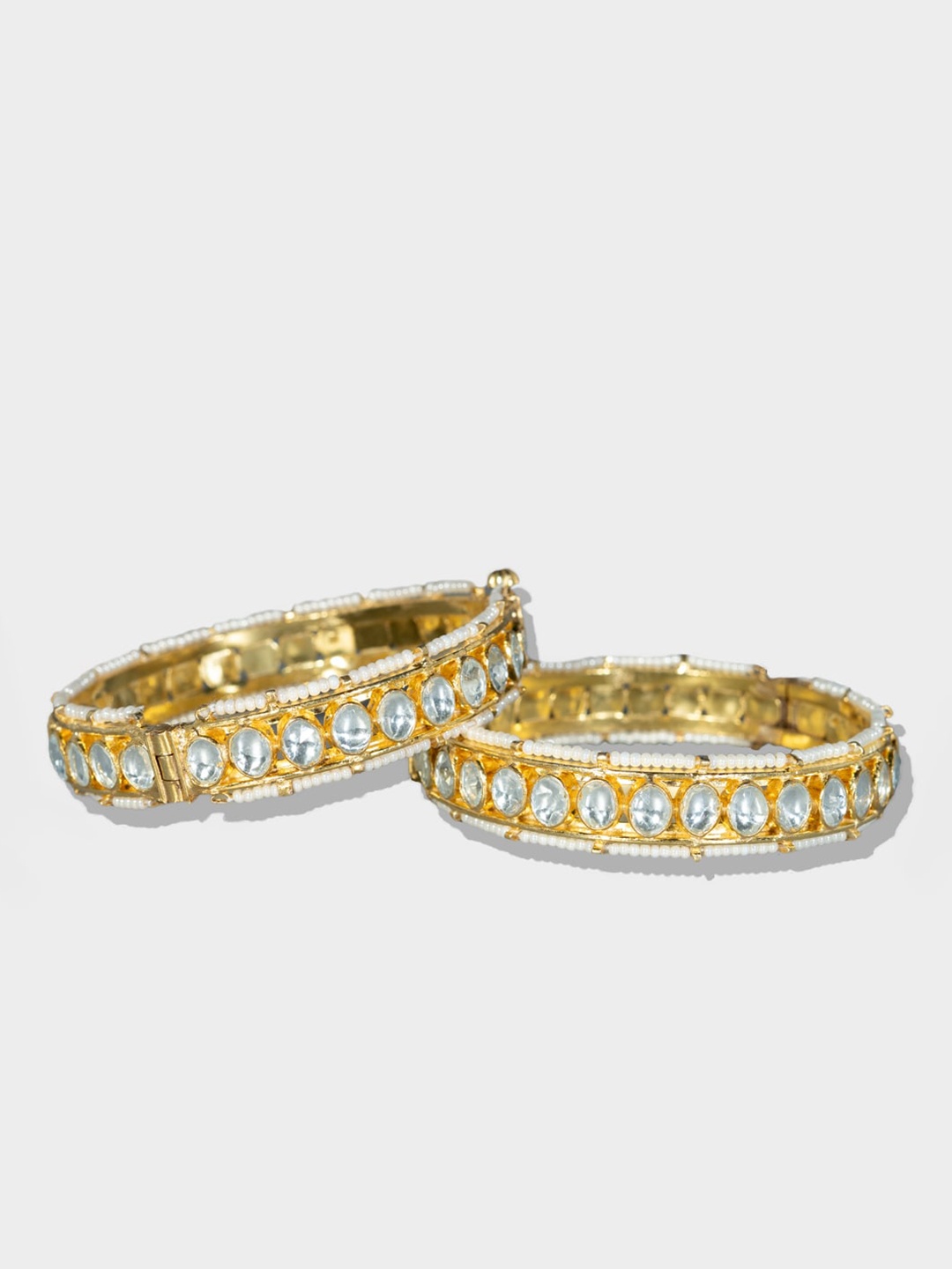 

AURAA TRENDS Set Of 2 Gold-Plated & White Kundan-Studded Bangles