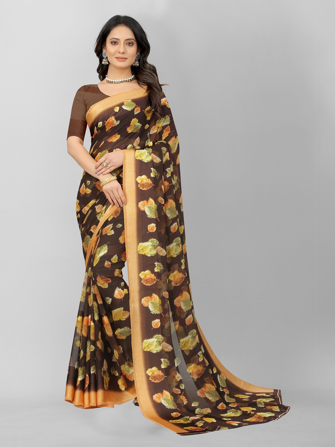 

APNISHA Brown & Yellow Floral Zari Pure Georgette Saree