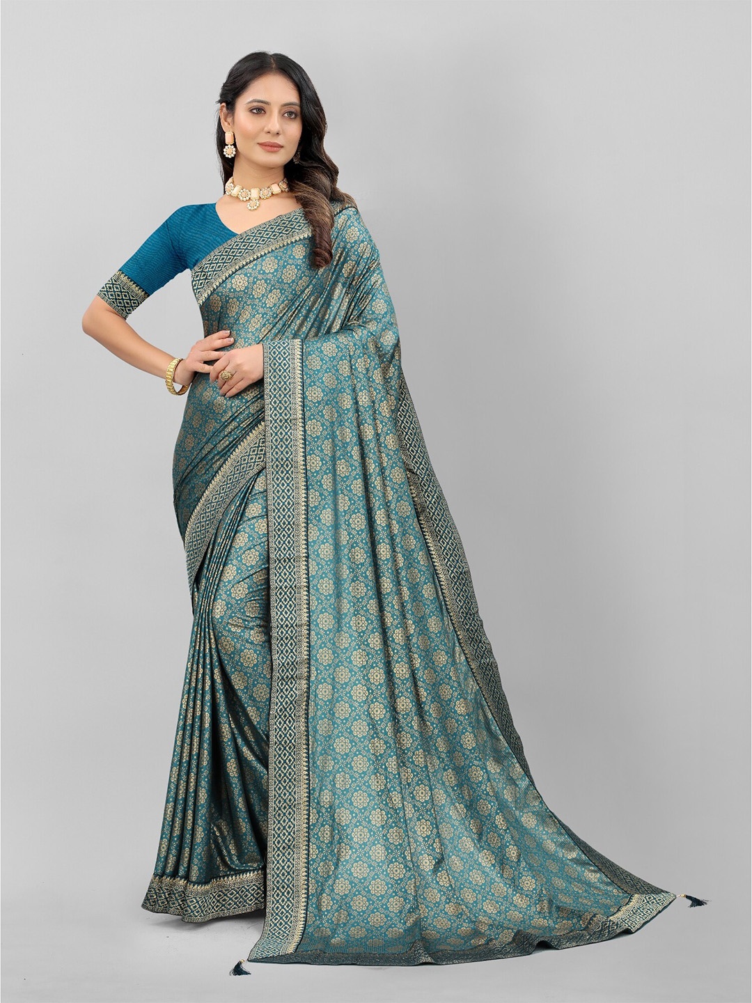 

APNISHA Blue & Gold-Toned Floral Zari Saree